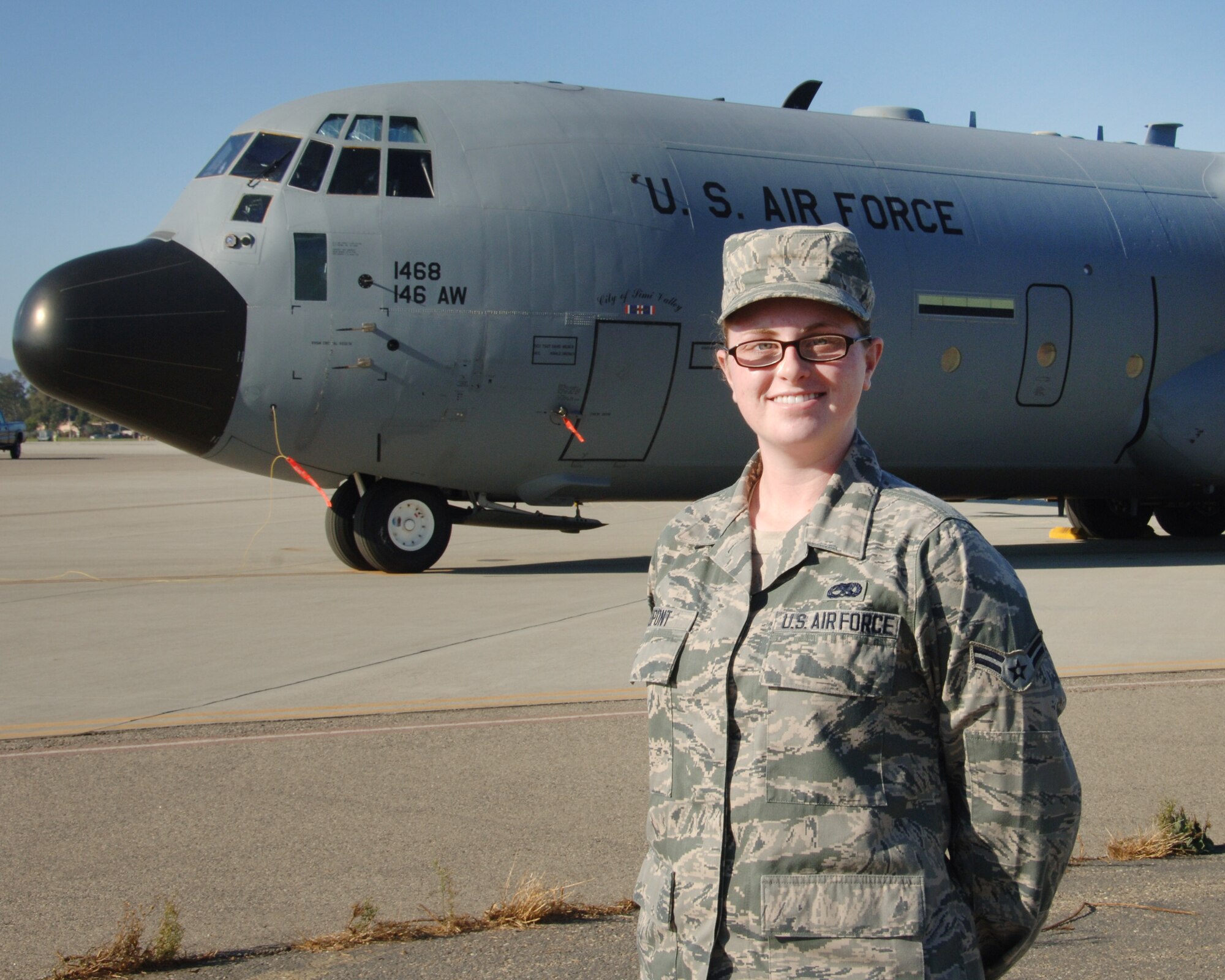 Meet Airman 1st Class Danielle Dupont, the newest addition to the 146th Airlift Wing's Maintenance, Aircraft Electrical and Environmental shop. We caught up with Dupont to find out a little more about her, who she is and what she sees in her future with the Air National Guard."  A native of the Camarillo area, Dupont grew up near the base and has known for a long time that the ANG was where she wanted to be. She just returned
recently from BMT and tech school and has been working to accomplish her "seasoning training" with her co-workers in Maintenance. Her supervisor boasts that she has a real aptitude within her field. "On her first day on the job, she was trouble-shooting electrical systems on the aircraft, and she found a problem that other more experienced people might have missed," said Master Sgt. Thomas Weaver.  "We have been very impressed with her and are glad to have her on our team." (photo by: Senior Airman Nicholas Carzis)