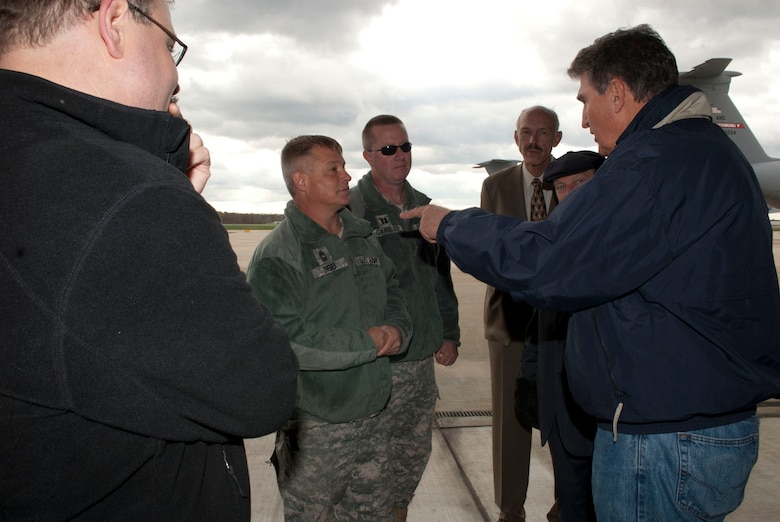 U.S. Senator Joe Manchin, D-W.Va., right, talks with Master Sgt. Keith Bibb and Capt. Douglas Garrett while at the 167th Airlift Wing, West Virginia Air National Guard, based in Martinsburg W.Va., Thursday Nov. 2, 2012. Sen. Manchin, W.Va. Governor Earl Ray Tomblin, and Major Gen. James Hoyer, adjutant general for W.Va., visited the base to survey the disaster relief staging facility in place. The 167th AW is serving as a staging area for disaster relief supplies which will then be transported throughout West Virginia as needed. The West Virginia National Guard has over 200 members aiding in recovery efforts from Hurricane Sandy.  The storm blanketed the state with heavy snow and rains and also had severe winds that left homes and properties damaged.  Guardsmen are involved in numerous aspects of the operations from search and rescue missions to debris removal. (Air National Guard photo by Master Sgt. Emily Beightol-Deyerle)