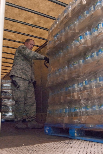 Tech. Sgt. Timothy Hageny maneuvers a pallet of water in a trailer full of FEMA disaster relief supplies at the 167th Airlift Wing, West Virginia Air National Guard, based in Martinsburg W.Va., Thursday Nov. 1, 2012. The 167th AW is serving as a staging area for disaster relief supplies which will then be transported throughout West Virginia as needed. The West Virginia National Guard has over 200 members aiding in recovery efforts from Hurricane Sandy.  The storm blanketed the state with heavy snow and rains and also had severe winds that left homes and properties damaged.  Guardsmen are involved in numerous aspects of the operations from search and rescue missions to debris removal. (Air National Guard photo by Master Sgt. Emily Beightol-Deyerle)