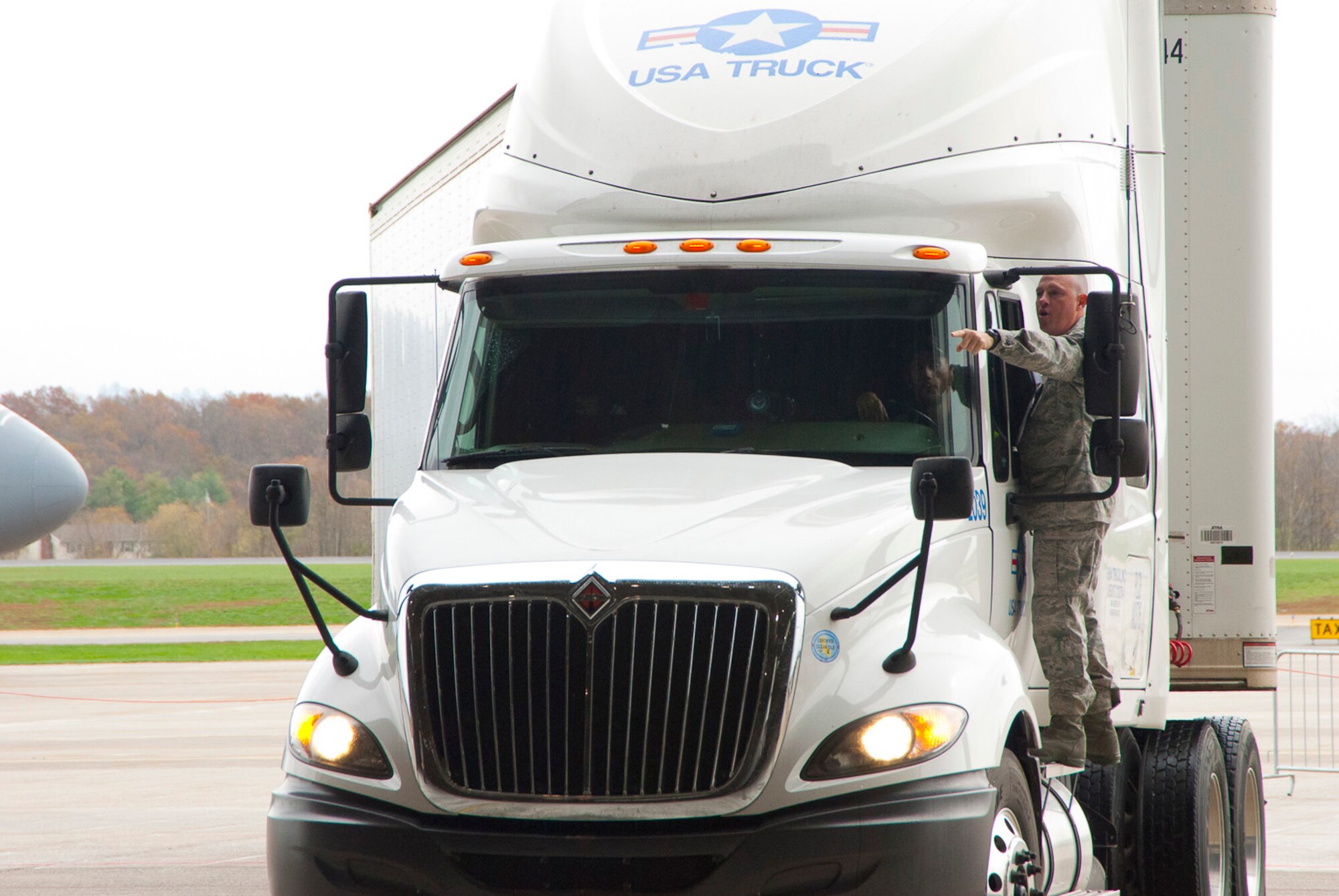 Master Sgt. Jodi Miller directs the driver of a FEMA tractor and trailer to a parking area inside a hangar at the 167th Airlift Wing, West Virginia Air National Guard, based in Martinsburg W.Va., Thursday Nov. 1, 2012. The 167th AW is serving as a staging area for disaster relief supplies which will then be transported throughout West Virginia as needed. The West Virginia National Guard has over 200 members aiding in recovery efforts from Hurricane Sandy.  The storm blanketed the state with heavy snow and rains and also had severe winds that left homes and properties damaged.  Guardsmen are involved in numerous aspects of the operations from search and rescue missions to debris removal. (Air National Guard photo by Master Sgt. Emily Beightol-Deyerle)