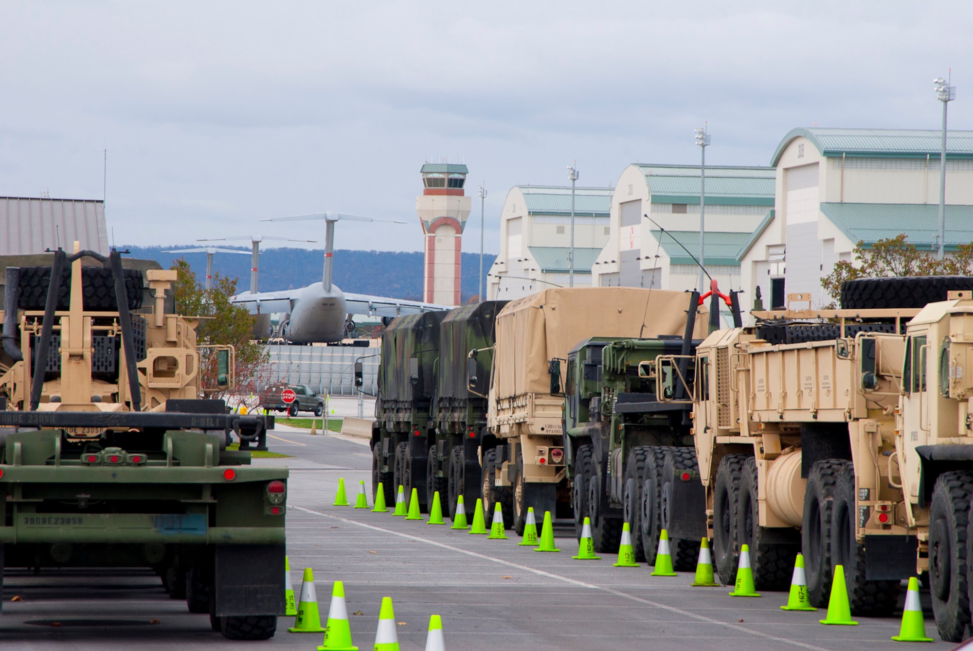 Vehicles assigned to the 77th Brigade’s 1201st Forward Support Company based in Kingwood W.Va. and Delta 230th FSC based in Glen Jean, W.Va are parked at the 167th Airlift Wing, West Virginia Air National Guard, based in Martinsburg W.Va., Thursday Nov. 1, 2012. The 167th AW is serving as a staging area for disaster relief supplies which will then be transported throughout West Virginia as needed. The West Virginia National Guard has over 200 members aiding in recovery efforts from Hurricane Sandy.  The storm blanketed the state with heavy snow and rains and also had severe winds that left homes and properties damaged.  Guardsmen are involved in numerous aspects of the operations from search and rescue missions to debris removal. (Air National Guard photo by Master Sgt. Emily Beightol-Deyerle)