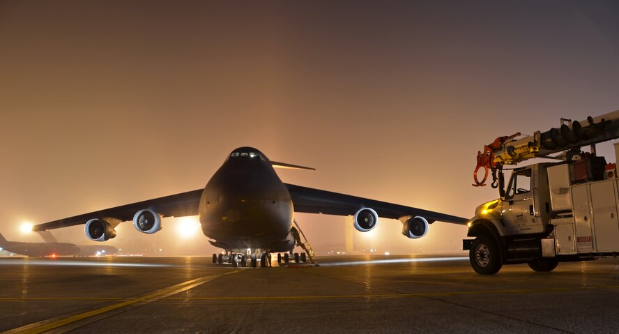 In response to President Obama's call for the government to support Hurricane Sandy relief efforts, a Westover C-5B flew to March Air Reserve Base, Calif., picked up 73 electrical workers and two utility trucks, and dropped them off at Stewart Air National Guard Base, near New York City, hours later. (U.S. Air Force photo/SrA. Kelly Galloway)