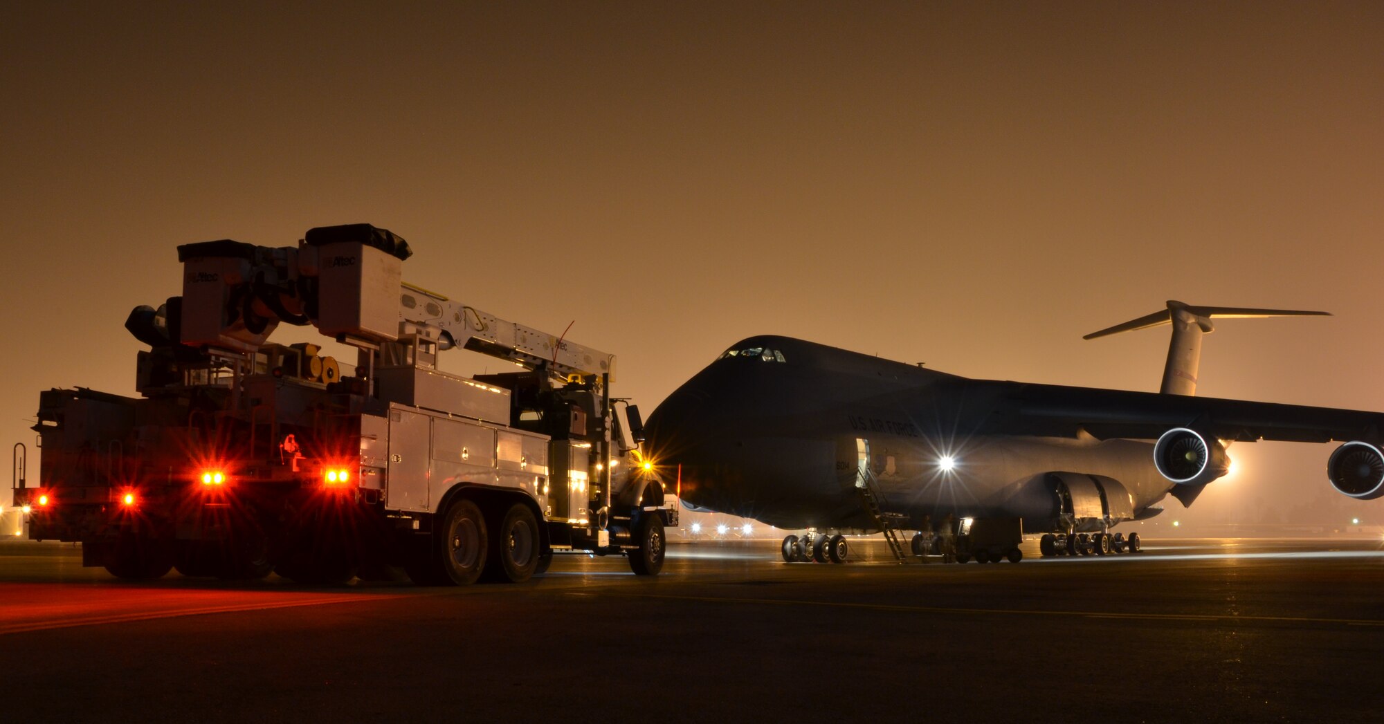 In response to President Obama's call for the government to support Hurricane Sandy relief efforts, a Westover C-5B flew to March Air Reserve Base, Calif., picked up 73 electrical workers and two utility trucks, and dropped them off at Stewart Air National Guard Base, near New York City, hours later. (U.S. Air Force photo/SrA. Kelly Galloway)