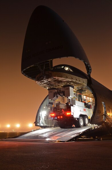 In response to President Obama's call for the government to support Hurricane Sandy relief efforts, a Westover C-5B flew to March Air Reserve Base, Calif., picked up 73 electrical workers and two utility trucks, and dropped them off at Stewart Air National Guard Base, near New York City, hours later. (U.S. Air Force photo/SrA. Kelly Galloway)
