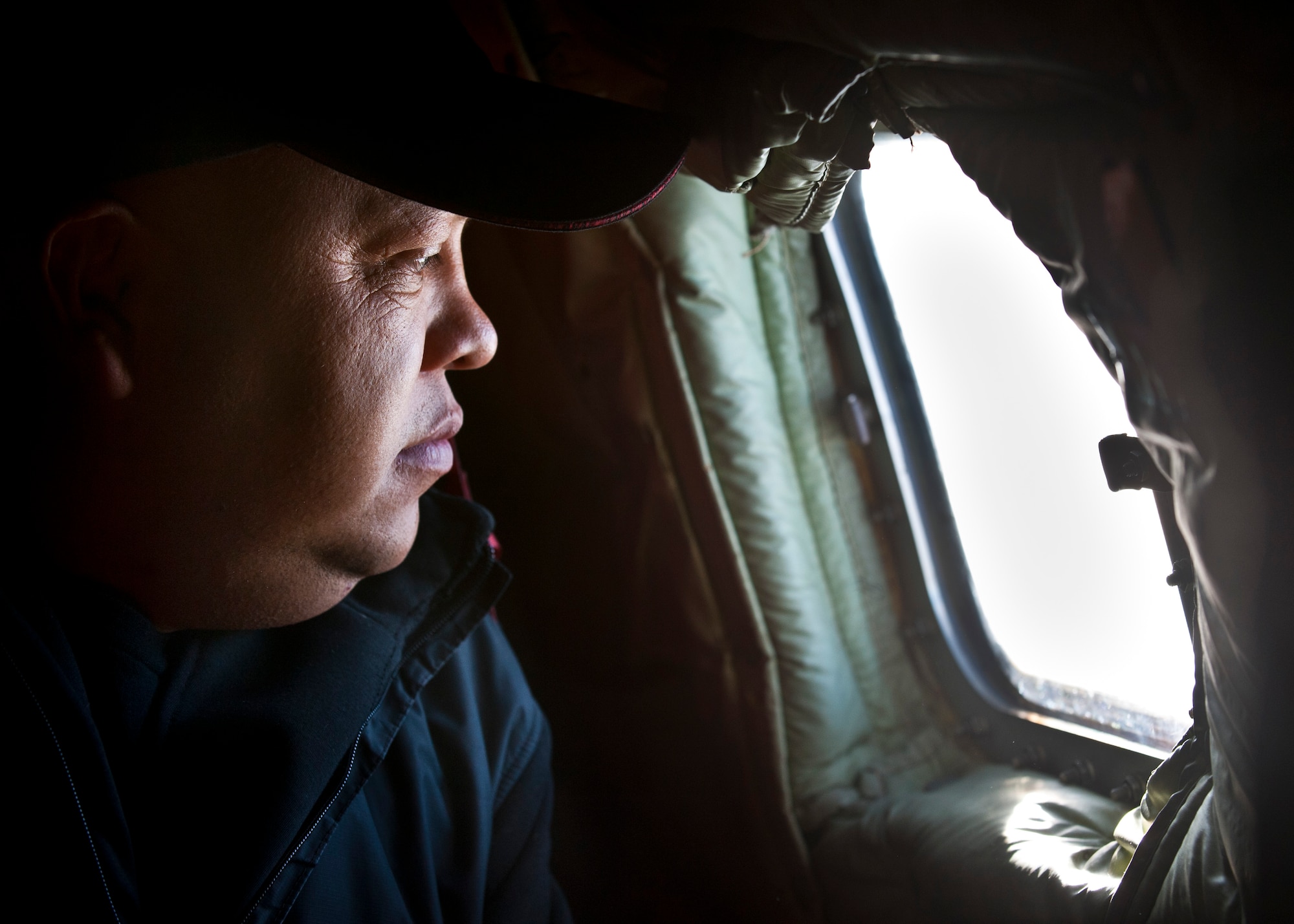 Amirjanov Akram looks out a window of a KC-135 Stratotanker during an air refueling demonstration over Kyrgyzstan, Nov. 2, 2012. Members of the Kyrgyz Republic Parliament toured the Transit Center at Manas and experienced an air refueling capabilities demonstration. Akram is a member of the Kyrgyz Republic Parliament. (U.S. Air Force photo/Senior Airman Brett Clashman)