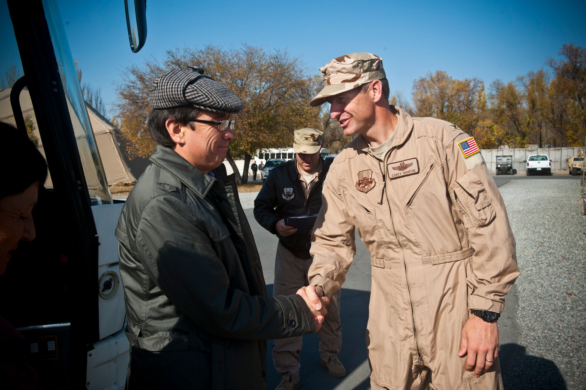 Right, Col. Corey Martin greets Abdymanap Kutushev and members of the Kyrgyz Republic Parliament during a visit at the Transit Center at Manas, Kyrgyzstan, Nov. 2, 2012. The Parliamentarians visited to learn about the Transit Center's mission set and the U.S. Air Force air refueling capabilities. Martin is the Transit Center director and Kutushev is a member of the Kyrgyz Republic Parliament. (U.S. Air Force photo/Senior Airman Brett Clashman)