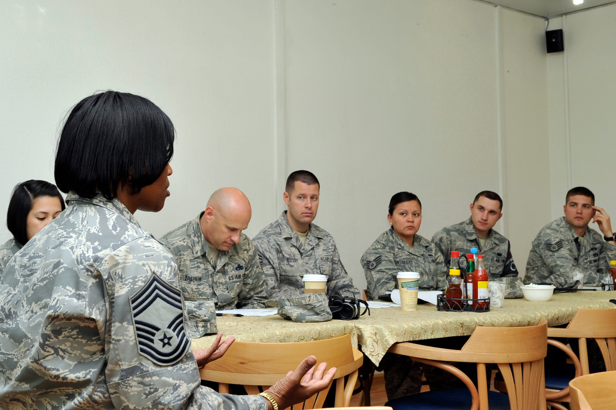 Chief Master Sgt. Priscilla Bolding discusses the enlisted assignment system with Airmen during a professional development lunch Oct. 26, 2012 at the Transit Center at Manas, Kyrgyzstan. Bolding, the Personnel Support for Contingency Operations team chief, discussed multiple avenues for enlisted members to take charge of their careers under the Air Force assignment system. (U.S. Air Force photo/Master Sgt. Jason Vaught)