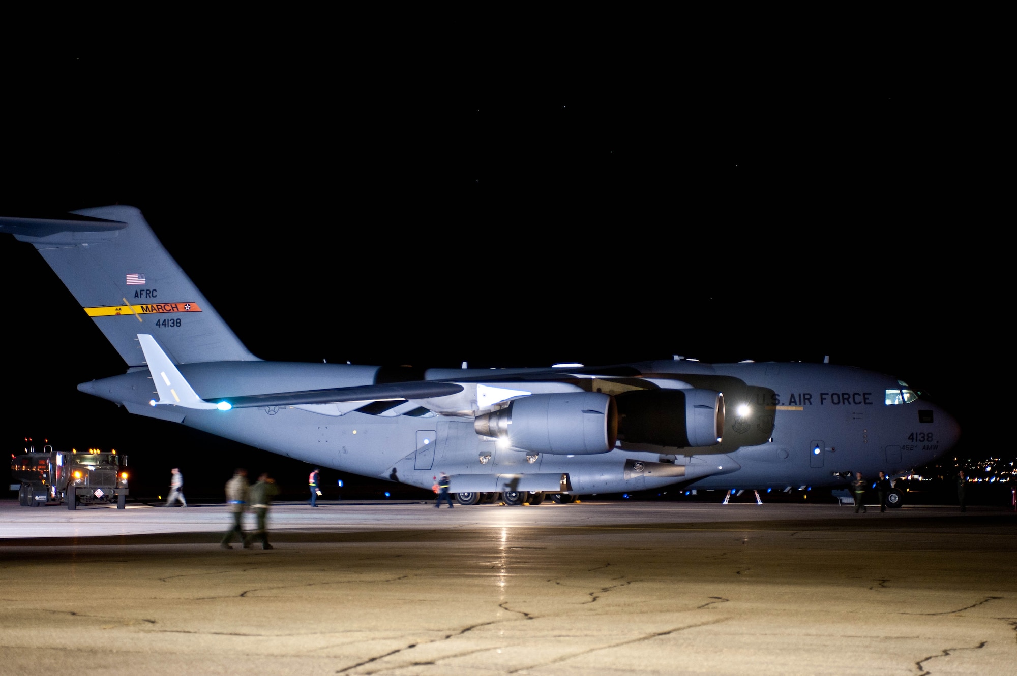 Reservists and technicians from March Air Reserve Base, Calif., arrive at Ellsworth Air Force Base, S.D., Nov. 2, 2012 in a C-17 Globemaster to refuel, pick up supplies, equipment, and Airmen to assist with the Hurricane Sandy relief effort. Eight Airmen from the 28th Civil Engineer Squadron departed to McGuire Air Force Base, N.J., to perform water removal and assist with structural issues. (U.S. Air Force photo by Airman 1st Class Zachary Hada/Released)