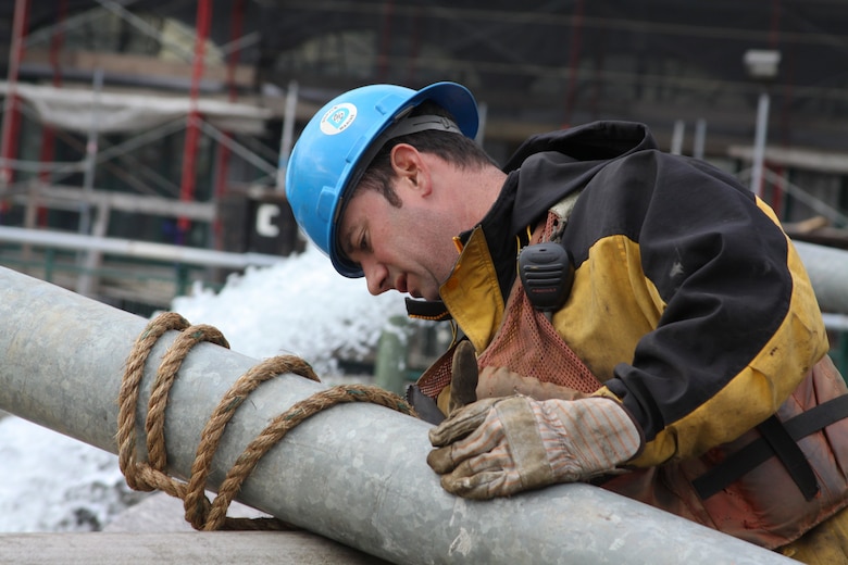 NEW YORK -- A contractor hooks up an outflow line from a second pump dewatering the Hugh Carey Tunnel also known as the Brooklyn Battery Tunnel.  The Corps is has been tasked by FEMA to dewater the impacted infrastructure in the City (U.S. Army photo/Patrick Bloodgood)