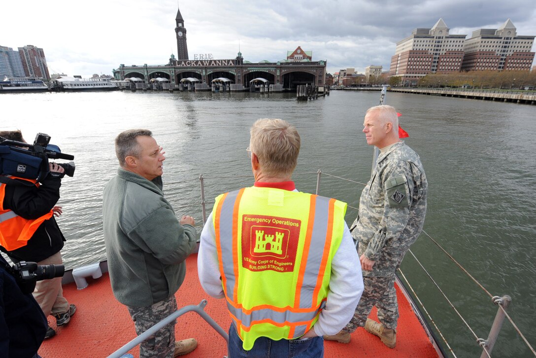 Army Major Gen. Kendall P. Cox, left, U.S. Army Corps of Engineers deputy commanding general for military and international operations, Col. Paul Owens, New York District Commander, center, and Joe Seebode, civilian deputy district engineer, discuss a plan of action to restore power to Hoboken Station, N.J., Nov. 2, 2012. 