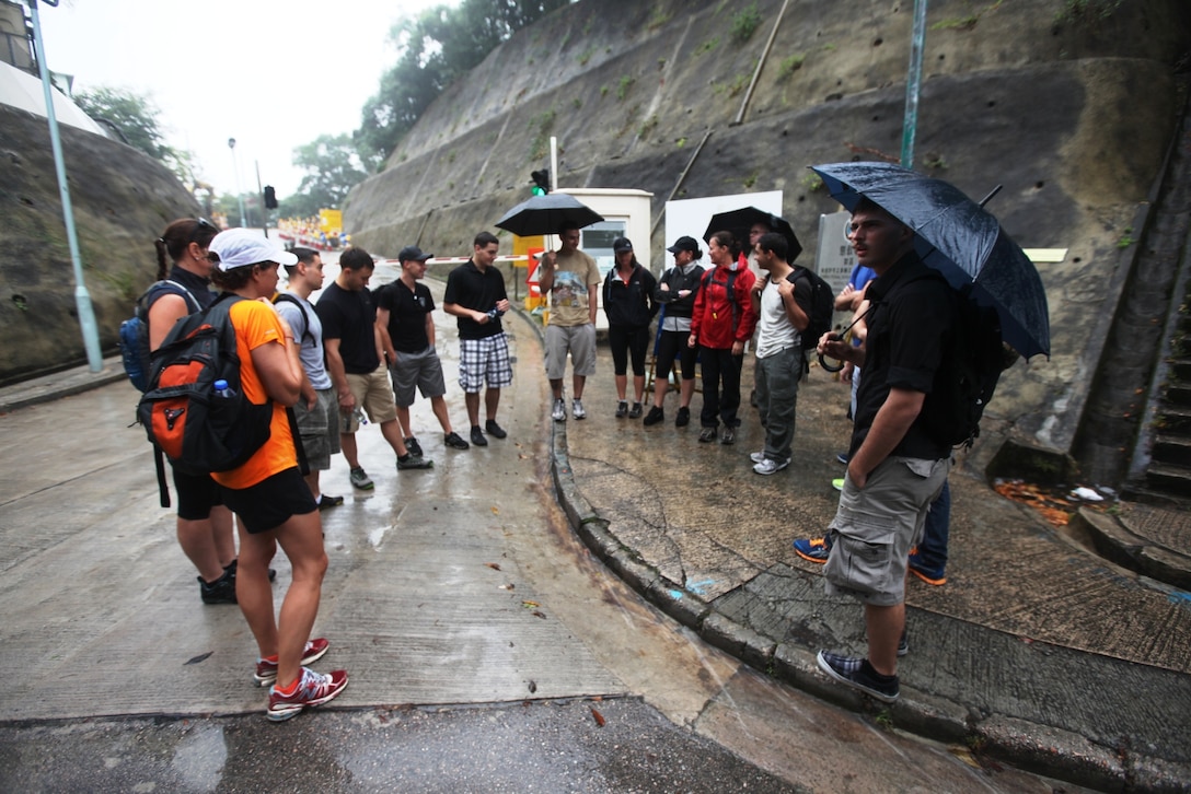 HONG KONG, Special Administrative Region, People’s Republic of China – Marines and Sailors of the 31st Marine Expeditionary Unit and Sailors from the USS Bonhomme Richard (LHD-6) gather with their hosts at the start of the "Dragon's Back," before proceeding on a hike here, Oct. 30. Five local women hosted the event as part of the American Women’s Association’s Meals in the Home program, where local sponsors take in service members for a day of fun and a home-cooked meal. 