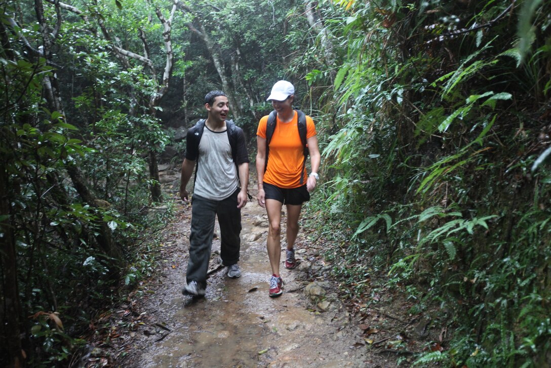 HONG KONG, Special Administrative Region, People’s Republic of China – Libby J. Alexander (right), a homemaker from Hong Kong originally from Waterville, Maine, walks with a Sailor from the USS Bonhomme Richard (LHD-6) during a hike of the “Dragon’s Back” trail here, Oct. 30. Marines and Sailors of the 31st Marine Expeditionary Unit joined Sailors from the ship in a morning hike of the scenic trail, followed by a family style, Thai lunch. Five local women hosted the event as part of the American Women’s Association’s Meals in the Home program, where local sponsors take in service members for a day of fun and a home-cooked meal. 