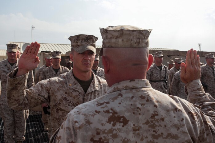 U.S. Marines with Regimental Combat Team 7 stand in formation during a promotion ceremony on Camp Leatherneck, Helmand province, Afghanistan, Oct. 31, 2012. The formation was held to recognize Capt. Preister's promotion to the rank of Major. (U.S. Marine Corps photo by SSgt. Ezekiel R. Kitandwe/Released)
