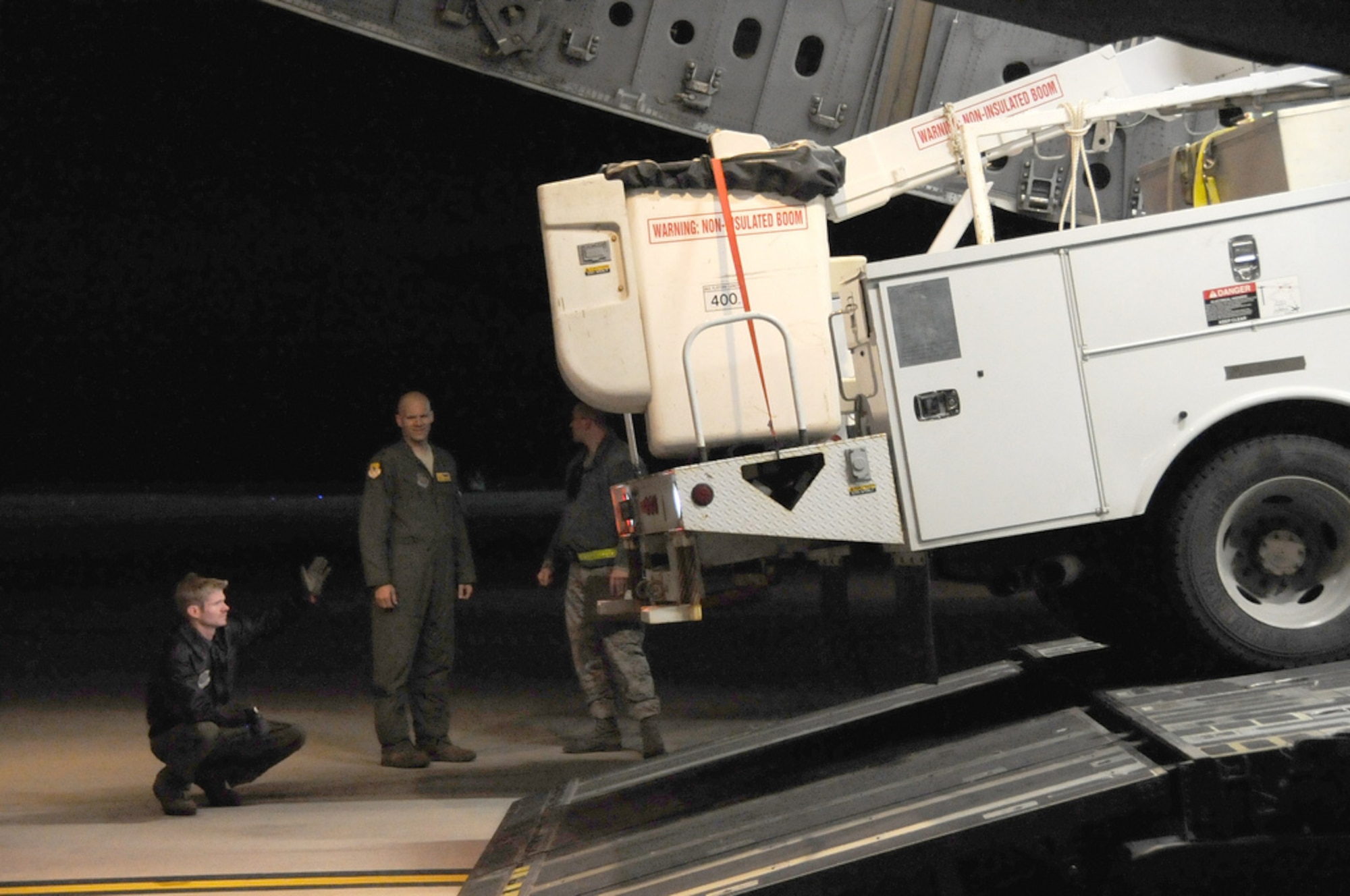 JOINT BASE MCGUIRE-DIX-LAKEHURST, N.J. -- Airmen from the 437th Airlift Wing, 16th Airlift Squadron, out of Joint Base Charleston, S.C., flew Hurricane Sandy relief supplies on a C-17 Globemaster III from Fairchild Air Force Base, Wash., to Joint Base McGuire-Dix-Lakehurst, N.J., Nov. 3, 2012. The supplies included two line trucks, a bucket truck and a set of mobile flood lights which will be used to support relief efforts in Staten Island and Long Island, N.Y. (U.S. Air Force photo by 2nd Lt. David J. Murphy/Released)