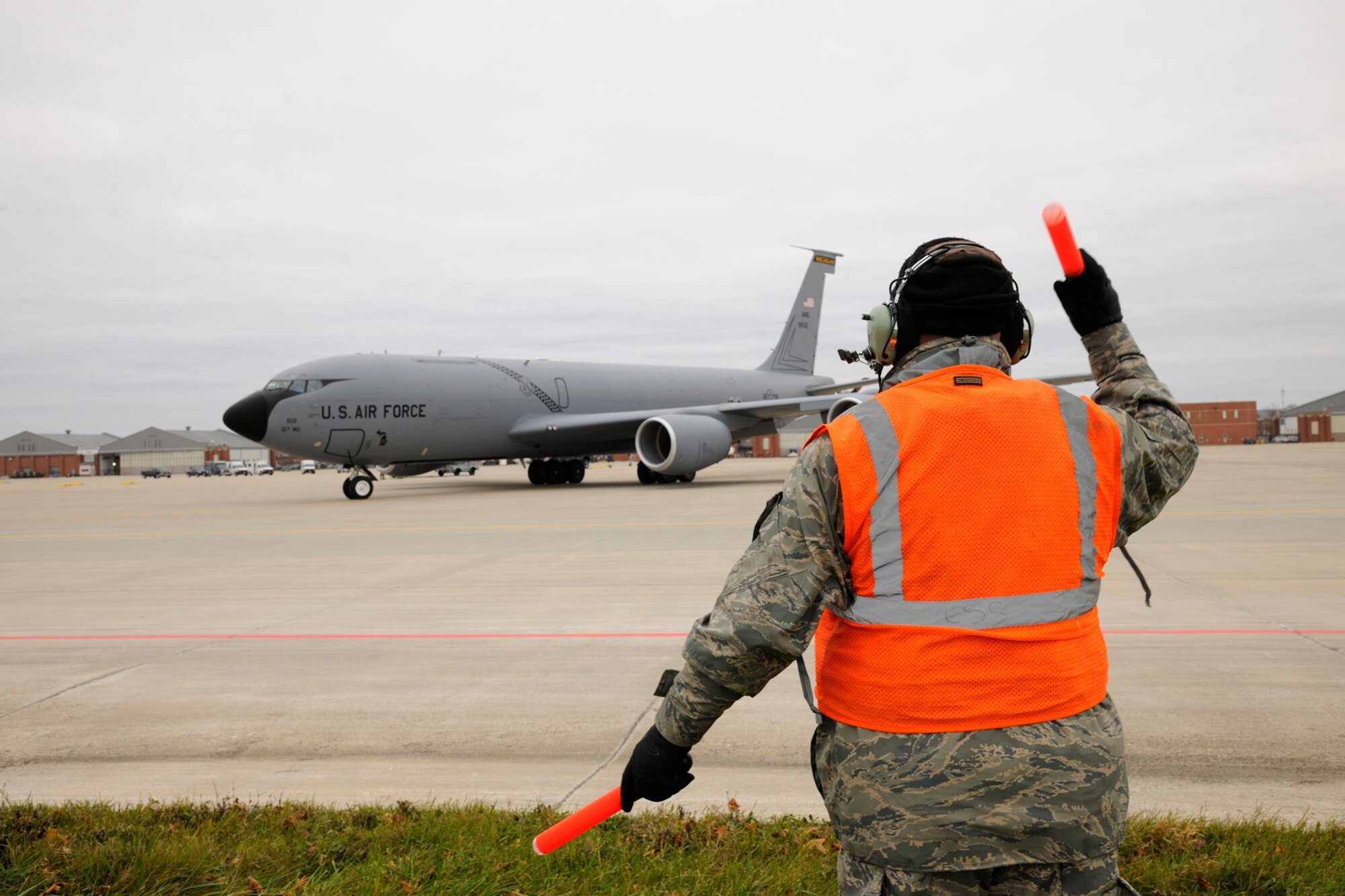 A crew chief from the 191st Aircraft Maintenance Squadron, marshals a K-C 135 Stratotanker to the flight line  during a “Launch the Fleet” training exercise at Selfridge Air National Guard Base, Mich., November 4, 2012. The 191st AMXS crew launched and recovered six K-C 135 Stratotankers throughout the day during a surge operation. (Air National Guard photo by TSgt. David Kujawa) (Released)