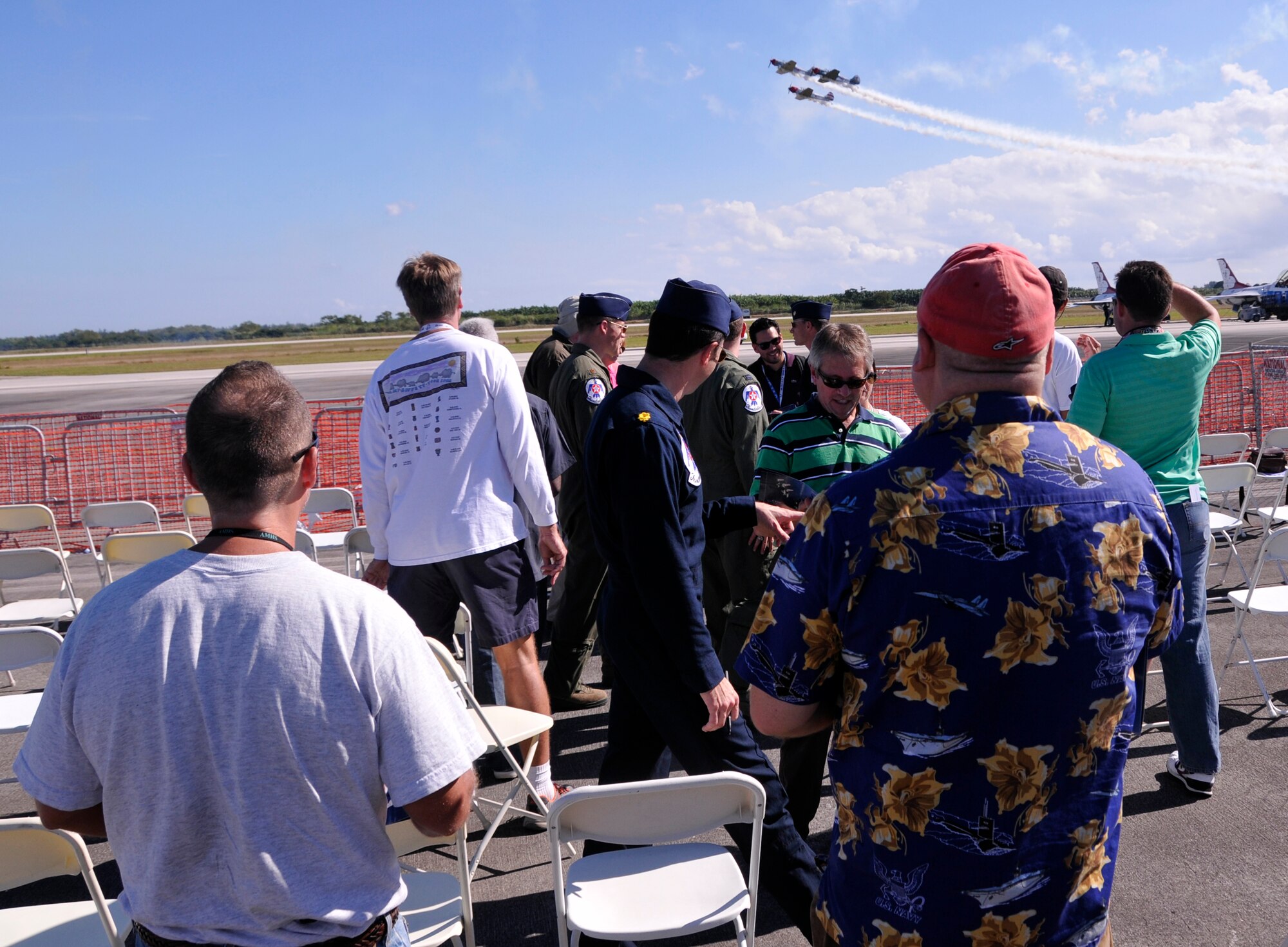 Visitors from the Wounded Warrior Project interact with the U.S. Air Force Thunderbirds pilots during the practice day for the Wings Over Homestead Air Show at Homestead Air Reserve Base, Fla., Nov. 2. (U.S. Air Force photo by/Staff Sgt. Lou Burton)
