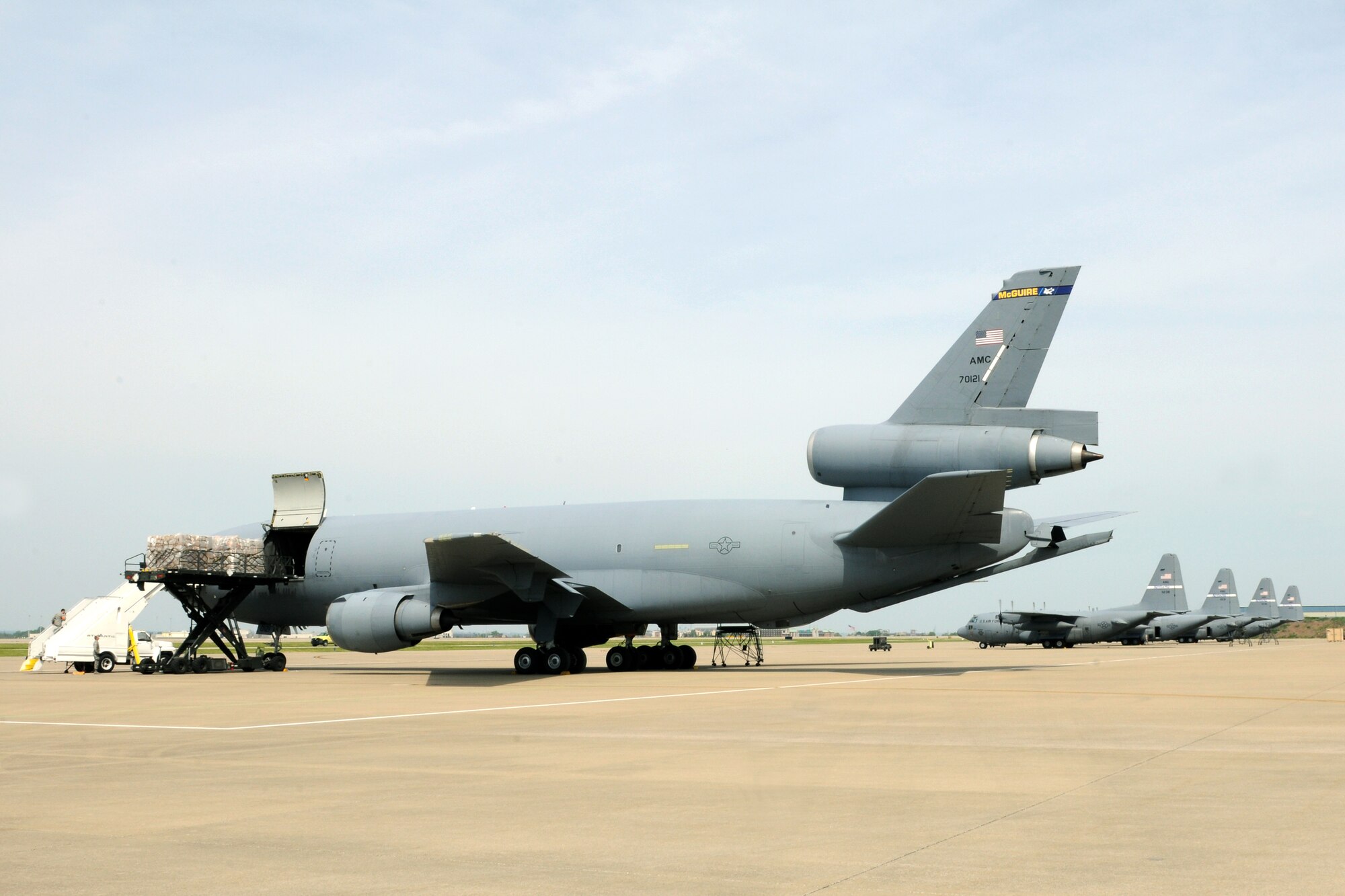 Aerial porters from the 123rd Logistics Readiness Squadron load humanitarian cargo bound for Haiti onto a KC-135 on the flight line of the Kentucky Air National Guard Base in Louisville, Ky., on April 15, 2012.  The effort was conducted through the Denton Program, a U.S. government initiative that allows private citizens and organizations to use space available on U.S. military planes to transport humanitarian goods. The cargo, provided by a Kentucky-based non-profit called Children???s Lifeline, included food and educational materials. (U.S. Air Force photo by Tech. Sgt. Dennis Flora)