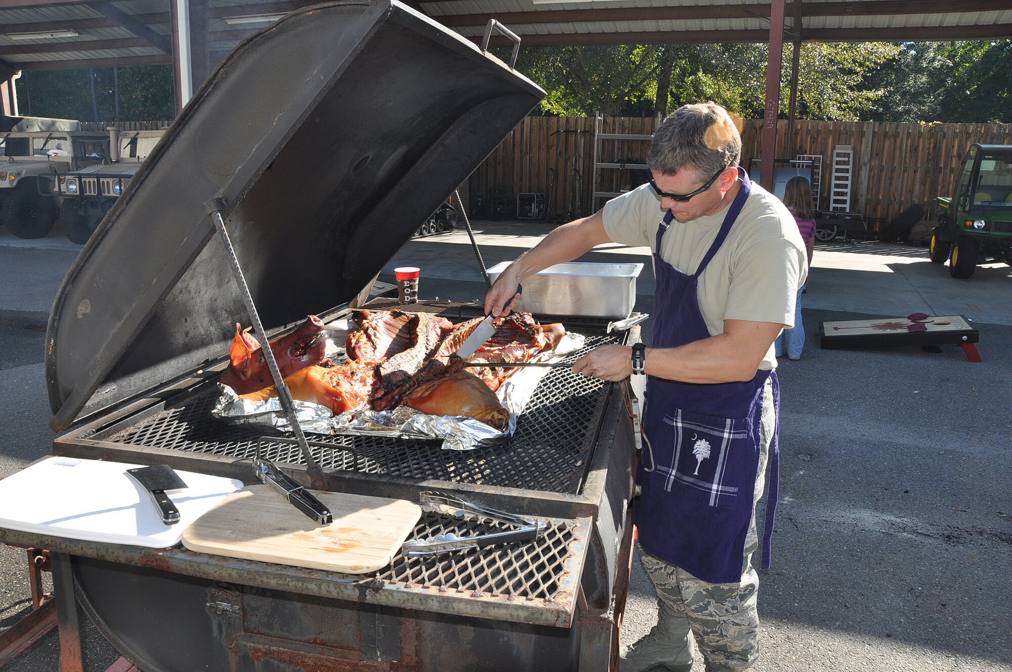 For the fourth consecutive year, Lt. Col. James C. Wood, commander of the 315th Civil Engineering Squadron, hosts a pig roast for his airmen here Saturday Nov. 3, 2012.  

