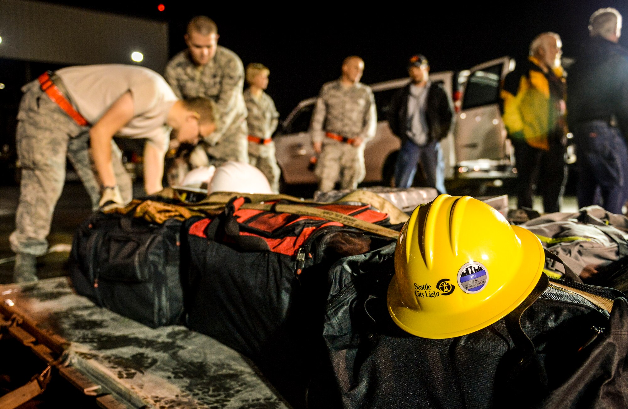 62nd Aerial Port Squadron Airmen secure a pallet of baggage belonging to workers from Seattle City Light utility company, Nov. 3, 2012, at Joint Base Lewis-McChord, Wash. The workers are part of the Hurricane Sandy relief efforts and travelled to McChord Field to be airlifted to New York to help bring electrical power back to the areas affected by the storm. (U.S. Air Force photo/Staff Sgt. Sean Tobin)
