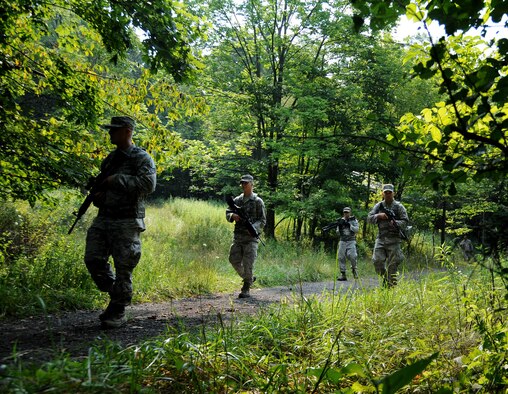 Members of the 911th Airlift Wing Security Forces Squadron perform a dismounted patrol as part of an integrated base defense core competency training mission at the firing range in Clinton, Pa., Aug. 9, 2012. The training mission, which also consisted of land navigation, defensive fighting positions, improvised explosive device recognition and unexploded ordinance handling, will enhance the Airmen’s deployment skills which makes them more efficient and effective during deployments. (U.S. Air Force photo by Senior Airman Joshua J. Seybert/Released)