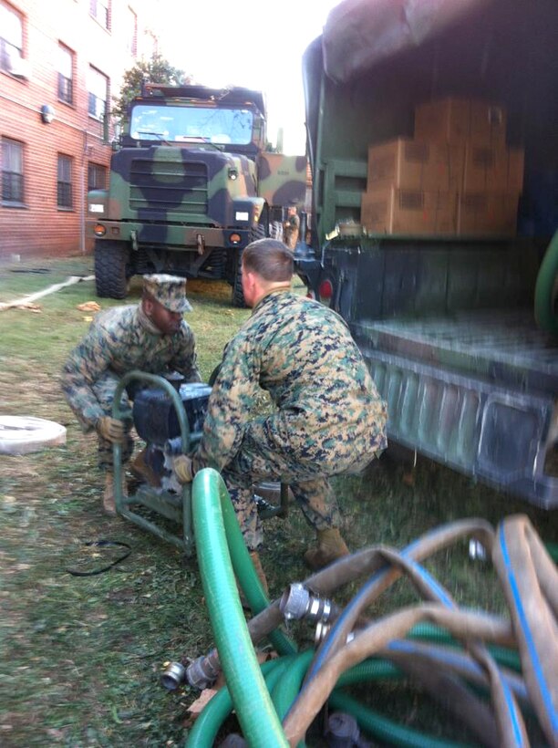 Marines begin pumping the fourth apartment building of the Ocean Bay housing complex in Far Rockaway, N.Y., Nov. 4, 2012.