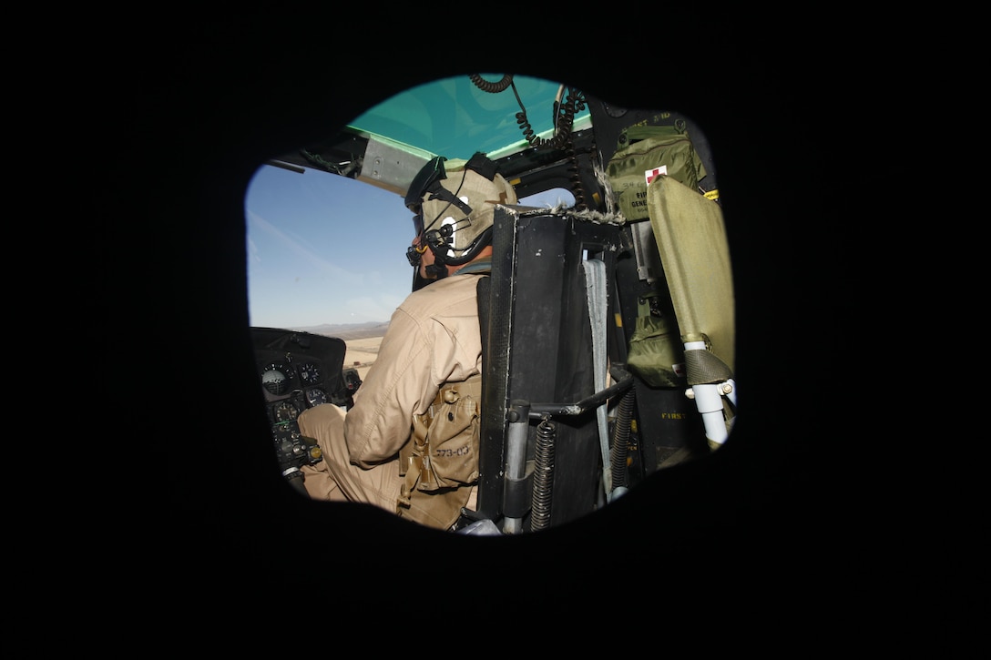 Capt. Michael Roberson, a UH-1N Huey utility helicopter pilot with Marine Light Attack Helicopter Squadron 773, Marine Aircraft Group 49, pilots a simulated close air support to ground troops at Fort Irwin, Calif., October 17, 2012.  HMLA-773 supported Marine Special Operations Command for three weeks, flying simulated close air supports, resupplies, casualty evacuations, battle damage assessments and aerial reconnaissance to make MARSOC’s predeployment training more realistic.