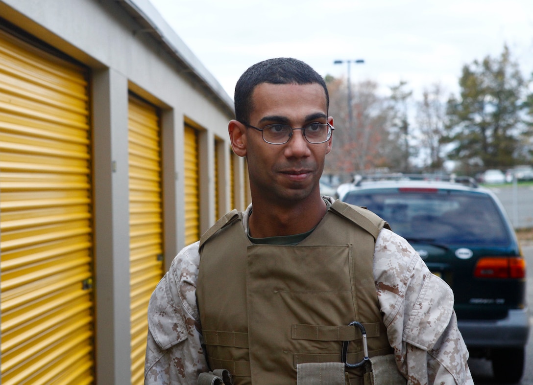 Marine Cpl. Christian Perez, a motor transport operator and a Union City N.J. native takes a break from unloading much-needed donations in the form of diapers, canned foods, clothes and blankets at a relief distribution site in Toms River N.J., Nov. 3, 2012. Following Hurricane Sandy, Marines from 6th Motor Transport Battalion, 4th Marine Logistics Group, utilized their 7-ton trucks to move donated relief supplies to distribution points amongst the most heavily affected areas. (U.S. Marine Corps photo by Staff Sgt. Nate Hauser/Released)