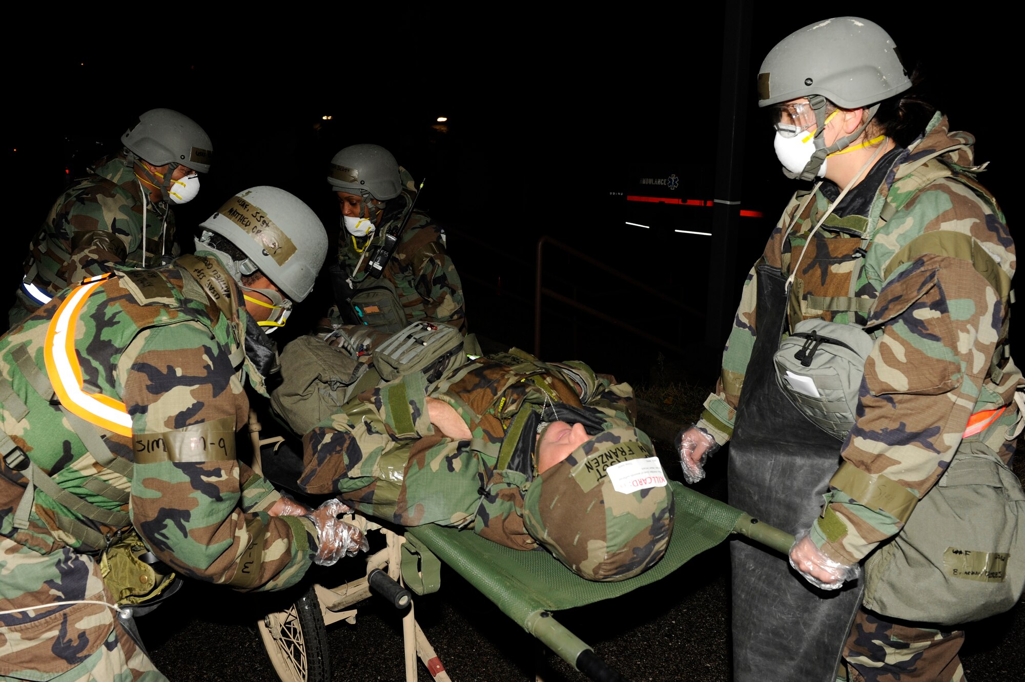 Members from the 8th Force Support Squadron strap Master Sgt. Joshua Franzen, 8th Aircraft Maintenance Squadronto a  litter after he was simulated as having a heart attack during exercise Beverly Bulldog 13-1 on Kunsan Air Base, Republic of Korea, Nov. 6, 2012. After the member was secured, he was taken for further medial assessment.(U.S. Air Force photo/Senior Airman Marcus Morris)