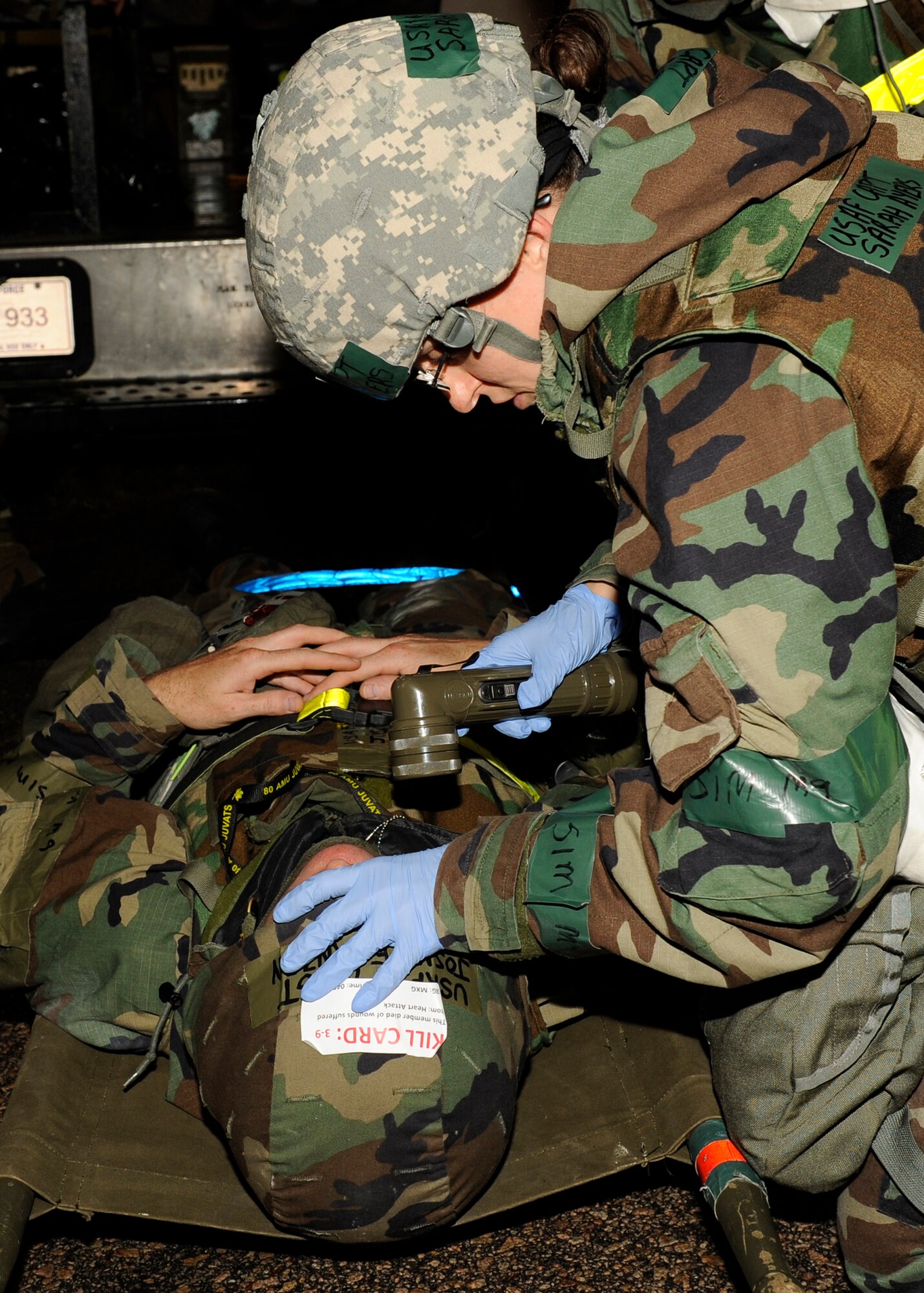 Capt. Sarah Ayers 8th Medical Operations Squadron checks the vitals of Master Sgt. Joshua Franzen, 8th Aircraft Maintenance Squadron during exercise Beverly Bulldog 13-1 on Kunsan Air Base, Republic of Korea, Nov. 6, 2012. The purpose of this inject was to find out how the loss of key personnel affects  the mission. (U.S. Air Force photo/Senior Airman Marcus Morris)