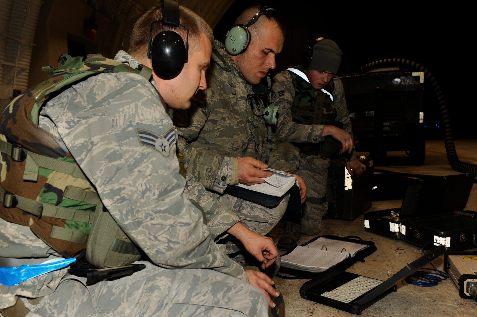 Airmen from the 8th Aircraft Maintenance simulate on a computer the combat load on an electronic countermeasure pod  during exercise Beverly Bulldog 13-1 at Kunsan Air Base, Republic of Korean, Nov. 4, 2012. The simulator allows maintenance to fix any problems with the ECM before it takes off. (U.S. Air Force photo/Senior Airman Marcus Morris)