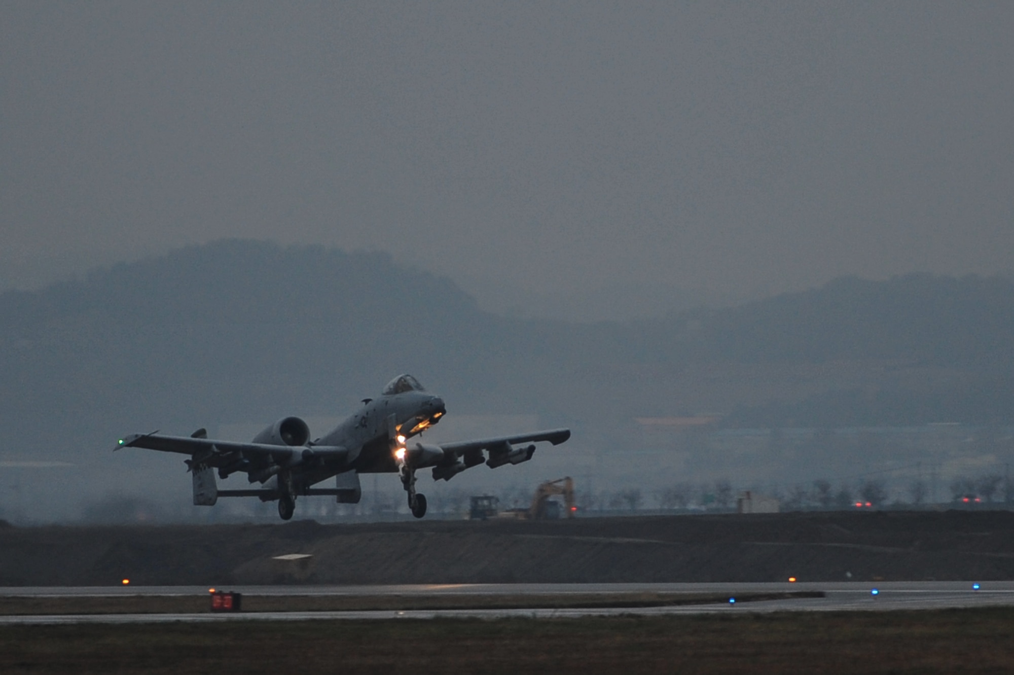 The first A-10 Thunderbolt II sortie for operational readiness exercise Beverly Bulldog 13-01 takes off from Osan Air Base, Republic of Korea, Nov. 6, 2012. Osan Airmen are in the fifth simulated wartime contingency exercise executed in 2012 that will test the base’s ability to defend and execute the mission in a heightened state of readiness. (U.S. Air Force photo/Staff Sgt. Craig Cisek)