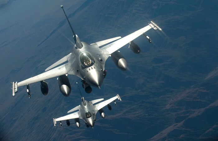 Two F-16 Fighting Falcons from the Alabama Air National Guard, approach a KC-135 Stratotanker, 350th Air Refueling Squadron, McConnell AFB, Kan., for refueling during the Green Flag-West 13-2 exercise Nov. 4, 2012. Green Flag-West exercises take place 10 times a year. (U.S. Air Force photo by Staff Sgt. Christopher Hubenthal)