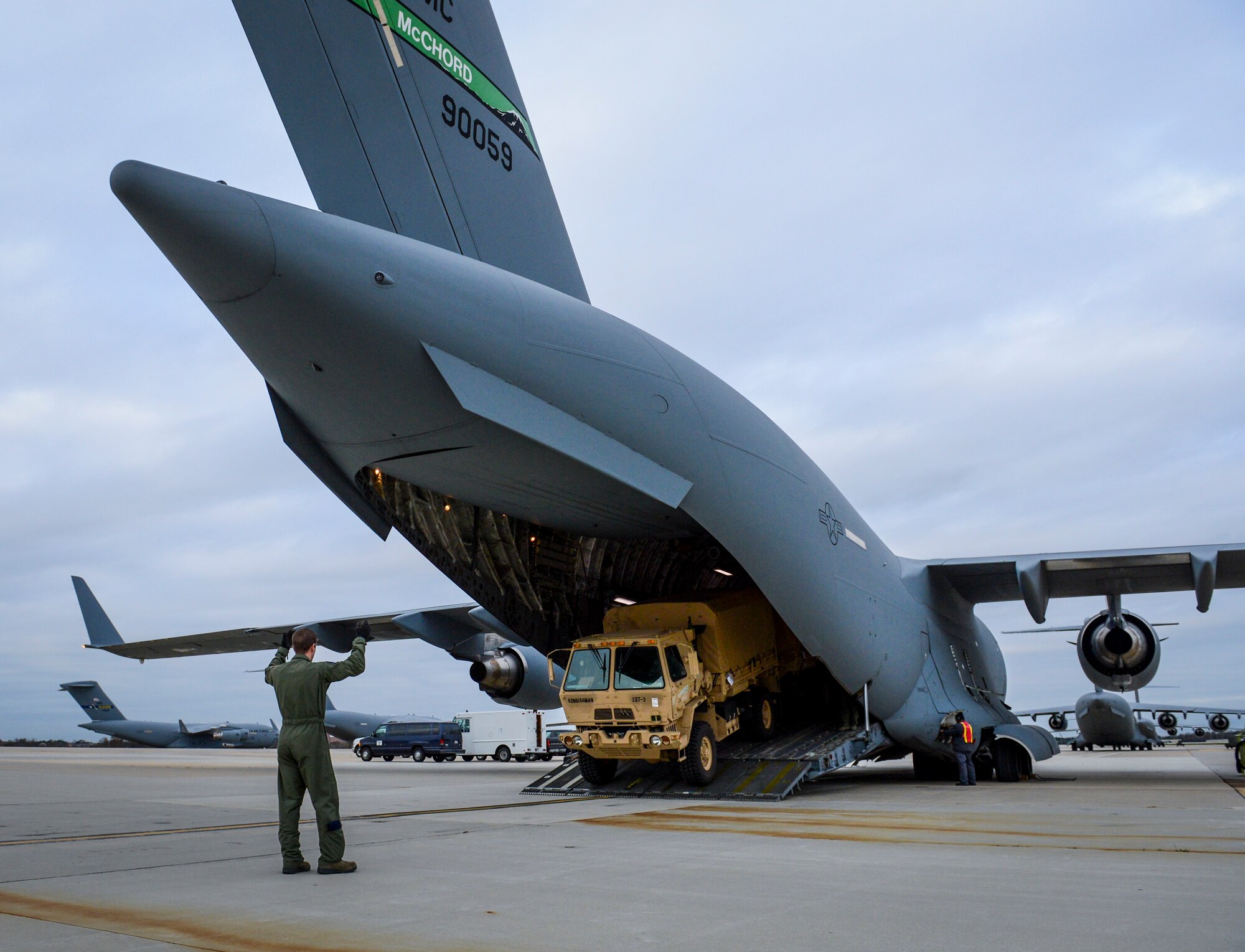 Airman 1st Class Patrick Russ, 8th Airlift Squadron loadmaster, marshalls a truck out of a C-17 Globemaster III aircraft, Nov. 5, 2012, in support of Hurricane Sandy relief efforts at Joint Base McGuire-Dix-Lakehurst, N.J. For Russ and the rest of the C-17 crew from Joint Base Lewis-McChord, Wash., this was their third mission in the last 5 days flying across the country in support of the relief efforts. (U.S. Air Force photo/Staff Sgt. Sean Tobin)
