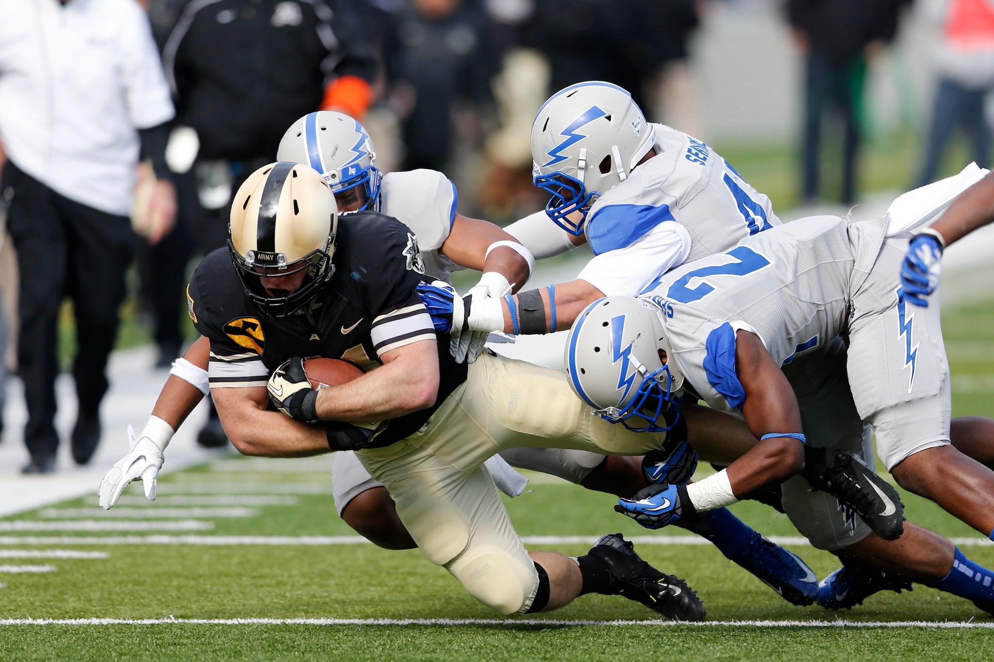 Air Force defenders bring down Army receiver Patrick Laird after a pass from Army quarterback Trent Steelman during the Falcons' game against the Black Knights at Michie Stadium in West Point, N.Y., Nov. 3, 2012. Air Force lost to Army, 41-21, marking the Falcons' first defeat to Army since 2005. (U.S. Army photo/Tommy Gilligan)