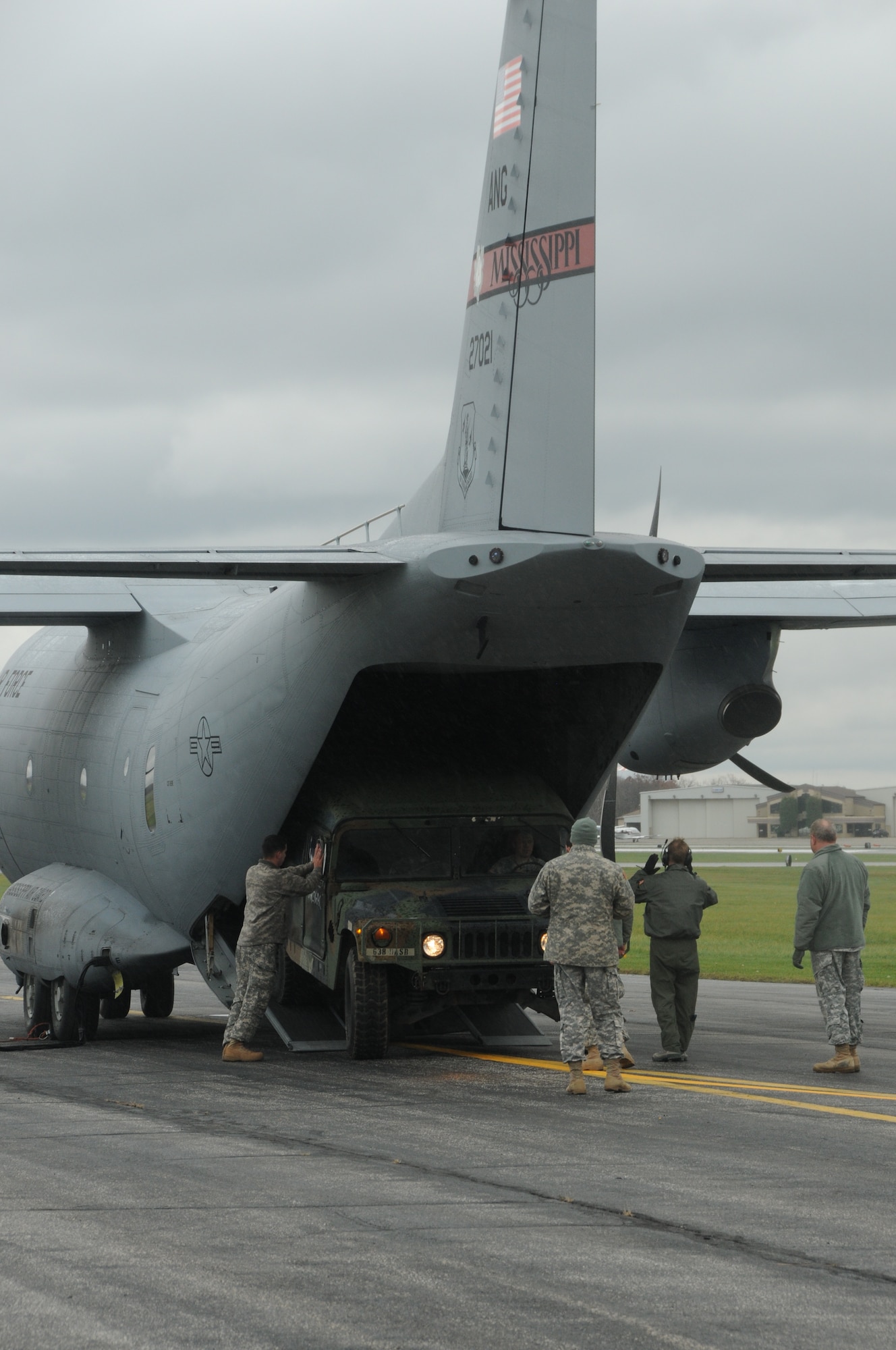 Members of the Ohio and Mississippi National Guard load a U. S. Army Humvee on board a Mississippi Air National Guard C-27J aircraft on the Akron-Canton Regional Airport, Green, Ohio, Nov. 3, 2012. The Humvee will be used to support the relief efforts of the New York National Guard in Brooklyn, NY, for the victims of Hurricane Sandy. (U. S. Air Force Photo by Tech. Sgt. Richard L. Smith/Released)