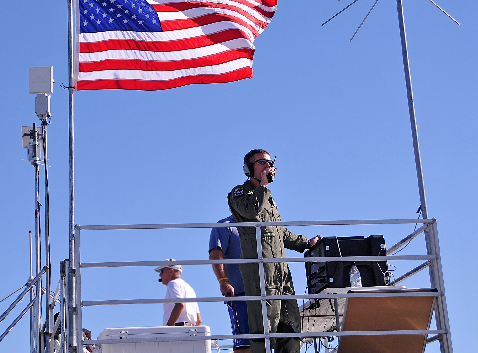 Lt. Col. Sean Carpenter, 2012 Wings Over Homestead Performance Coordinator, talks to a aircraft performing in the 2012 Wings over Homestead Air Show Nov. 3. The 482nd Communications Squadron programmed radios for air show key personnel to be able to communicate with multiple agencies simultaneously throughout the show. (U.S. Air Force Photo/Senior Airman Jacob Jimenez)