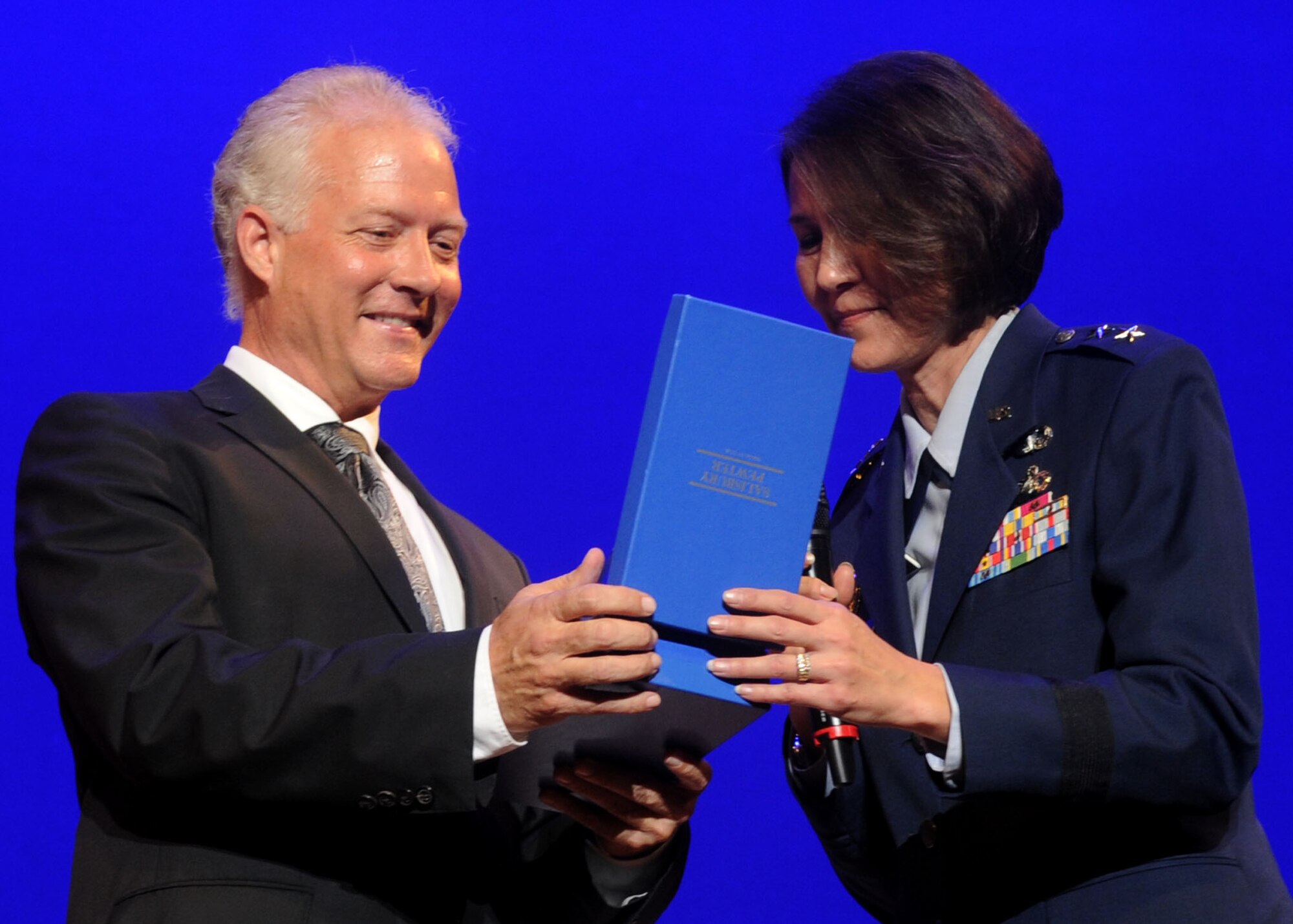 Maj. Gen. Sharon Dunbar Air Force District of Washington commander, presents Guest Artist Andy Martin with a gift on behalf of the command for his collaboration with the U.S. Air Force Band Airmen of Note during a Jazz Heritage Series concert at George Washington University's Lisner Auditorium in Washington, D.C., Oct. 26, 2012. The Airmen of Note is the premier jazz ensemble of the United States Air Force Band.    