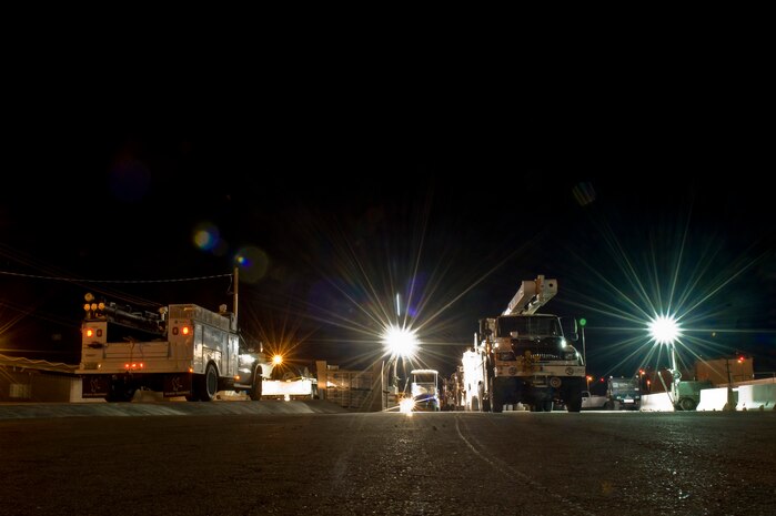 NV Energy’s trucks sit at the weigh station before being shipped to the east coast to be used in relief efforts after Hurricane Sandy Nov. 5, 2012, at Nellis Air Force Base, Nev. Airmen from the 99th Logistics Readiness Squadron weigh and inspect each piece of equipment before loading them on aircraft. (U.S. Air Force photo by Senior Airman Daniel Hughes)