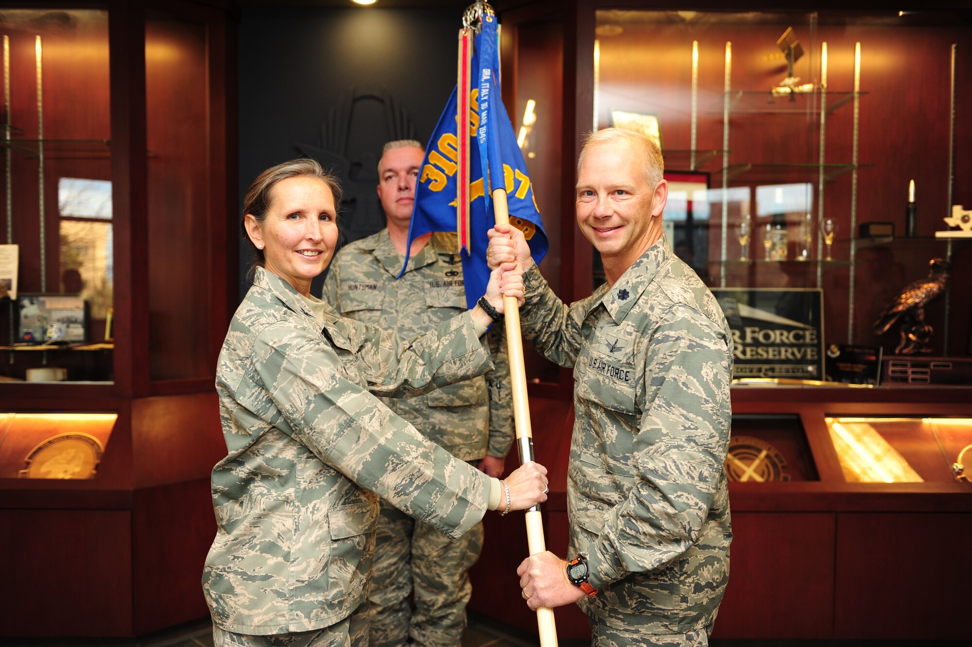 U.S. Air Force Col. Traci L. Kueker-Murphy, 310th Operations Group commander, presents the 379th Space Range Squadron guidon to U.S. Air Force Lt. Col. Clifton D. Stargardt as he assumes command during the activation of the 379 SRS on Schriever Air Force Base, Colo., Nov. 4, 2012. The 379 SRS was originally activated in 1942 as the 379th Bombardment Squadron and deactivated in 1945 with the cessation of operations during World War II. The 379 BS was one of four squadrons that fell under the 310th Bombardment Group, 57th Bomb Wing, now active with the 310th Space Wing.  Of the four bomb squadrons activated under the 310 BG during World War II, the 379 BS, 380 BS, 381 BS, and 428 BS, the 310 SW has regained operational missions for two of the squadrons, the 380th Space Control squadron, and now the 379 SRS.
(U.S. Air Force photo by Tech. Sgt. Nicholas B. Ontiveros/Released)