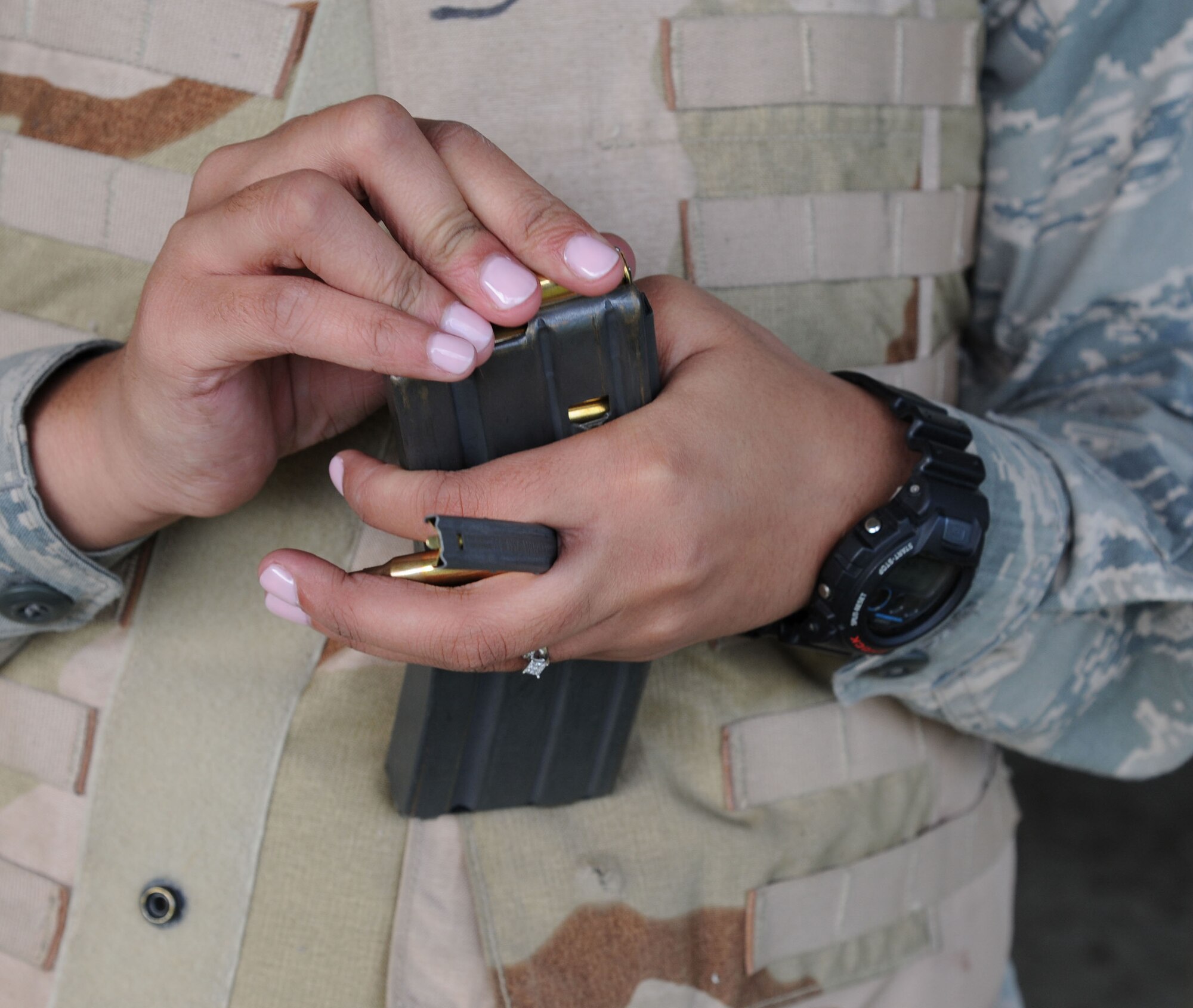U.S. Air Force Airman 1st Class Tiana Zakariyyaa, 633rd Security Forces Squadron member, loads an M4 carbine magazine during a qualifying class at Langley Air Force Base, Va., Nov. 1, 2012. Security personal must qualify on daylight and night-vision shooting. (U.S. Air Force photo by Airman 1st Class Victoria Taylor/Released)