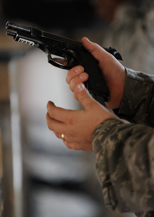 U.S. Air Force Staff Sgt. Mathew Delmonico, 633rd Security Forces Squadron response force leader, loads a 9mm M9 Beretta at Langley Air Force Base, Va., Nov. 1, 2012. Security Forces personnel required to demonstrate proper loading techniques during a qualification assessment. (U.S. Air Force photo by Senior Airman Racheal E. Watson/Released)