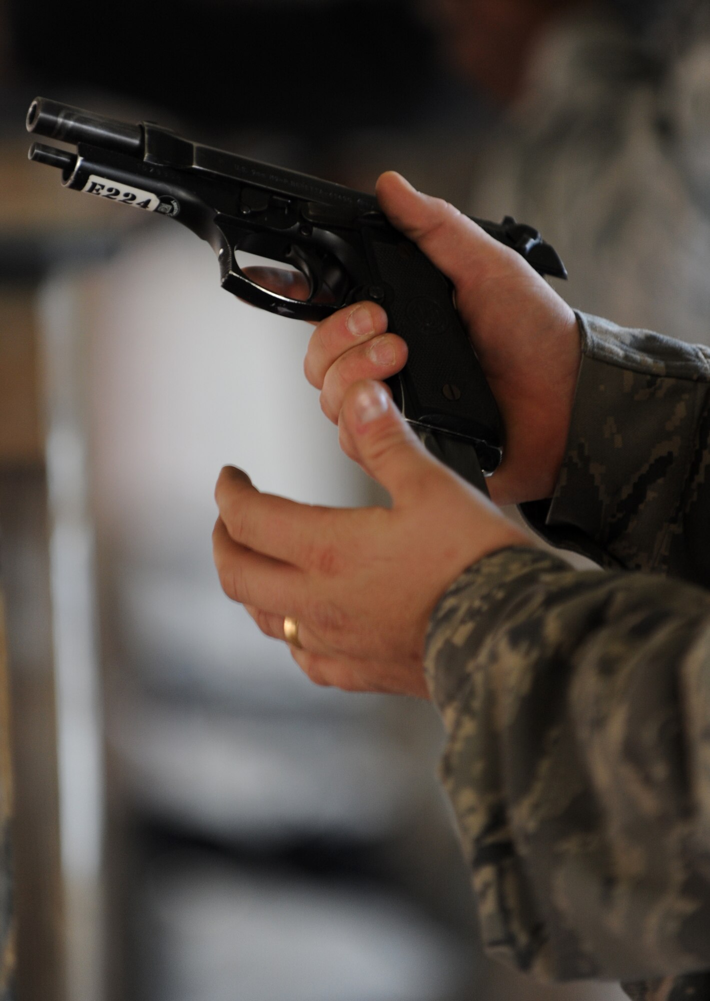 U.S. Air Force Staff Sgt. Mathew Delmonico, 633rd Security Forces Squadron response force leader, loads a 9mm M9 Beretta at Langley Air Force Base, Va., Nov. 1, 2012. Security Forces personnel required to demonstrate proper loading techniques during a qualification assessment. (U.S. Air Force photo by Senior Airman Racheal E. Watson/Released)