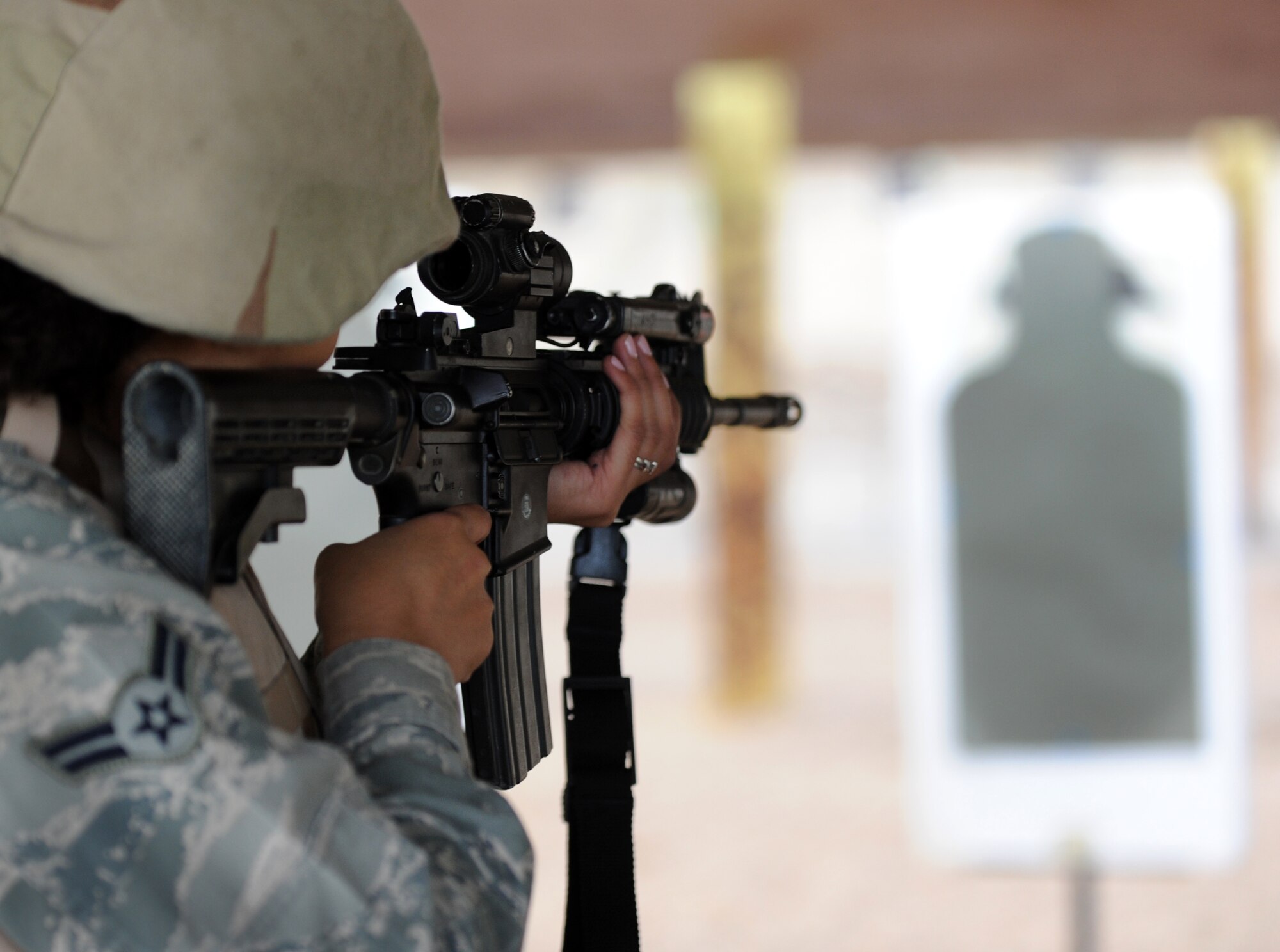U.S. Air Force Airman 1st Class Tiana Zakariyya, 633rd Security Forces Squadron member, aims a 5.56mm M4 Carbine downrange at Langley Air Force Base, Va., Nov. 1, 2012. Security Forces personnel test their firing abilities through a qualification assessment in different firing positions. (U.S. Air Force photo by Senior Airman Racheal E. Watson/Released)