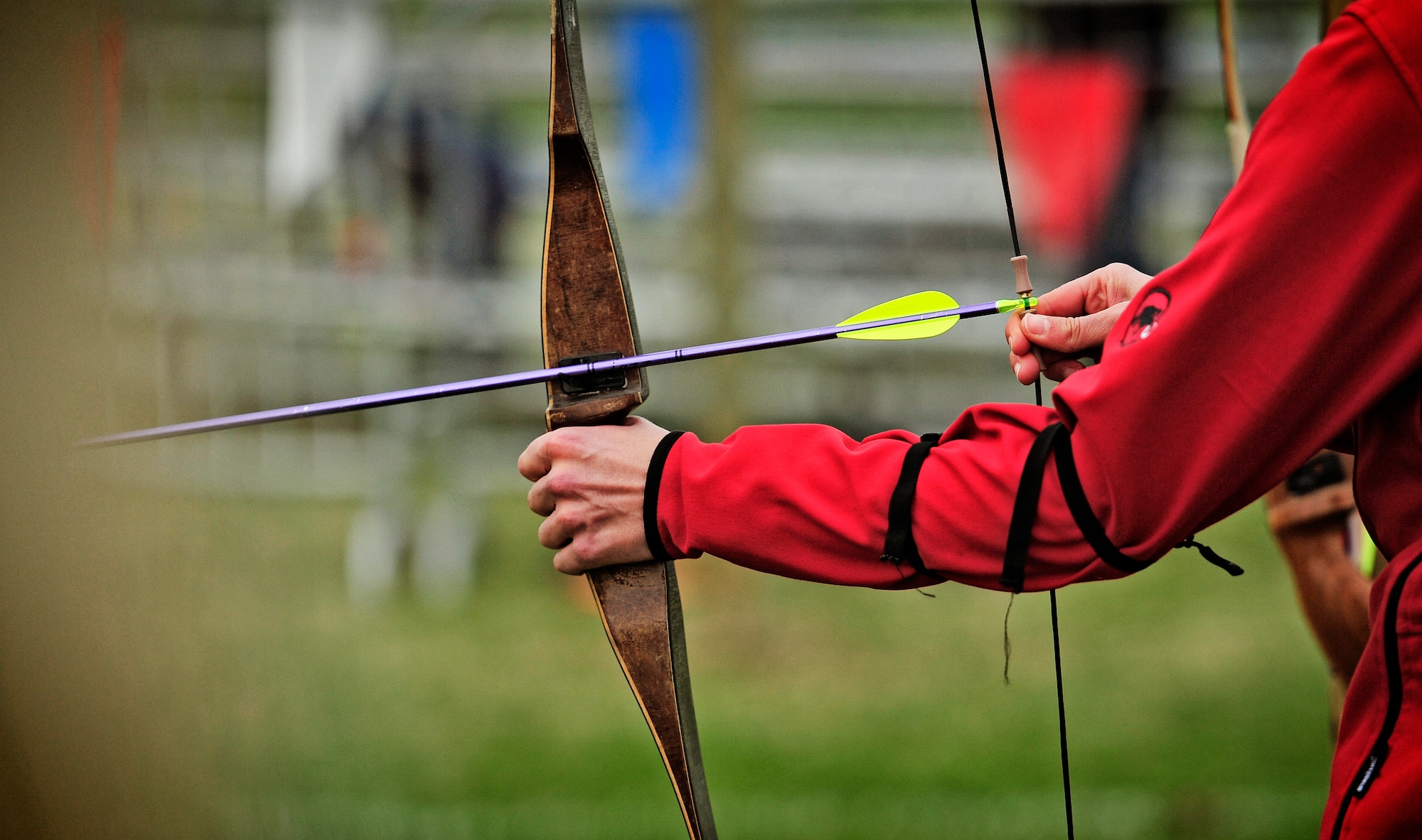 Capt. Rebecca Bissette, Air Mobility Command, prepares to draw her bow during an archery tournament at Scott Air Force base Nov. 5. The Scott Outdoor Recreation hosted the event which was opened to all ages and skill levels. The top finisher was Jared Lyles, 13. (U.S. Air Force photo/ Staff Sgt. Ryan Crane)