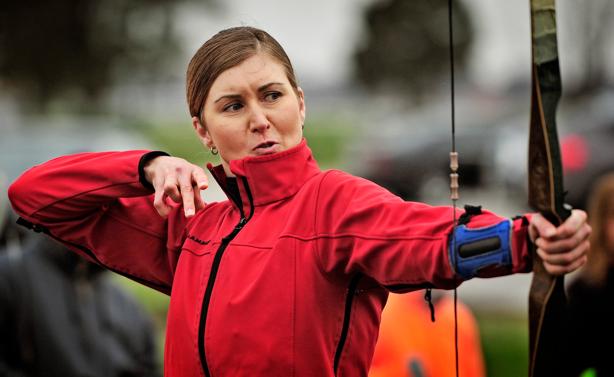 Capt. Rebecca Bissette, Air Mobility Command, holds her form after firing an arrow at her target during an archery tournament at Scott Air Force base Nov. 5. The Scott Outdoor Recreation hosted the event which was opened to all ages and skill levels. The top finisher was Jared Lyles, 13. (U.S. Air Force photo/ Staff Sgt. Ryan Crane)