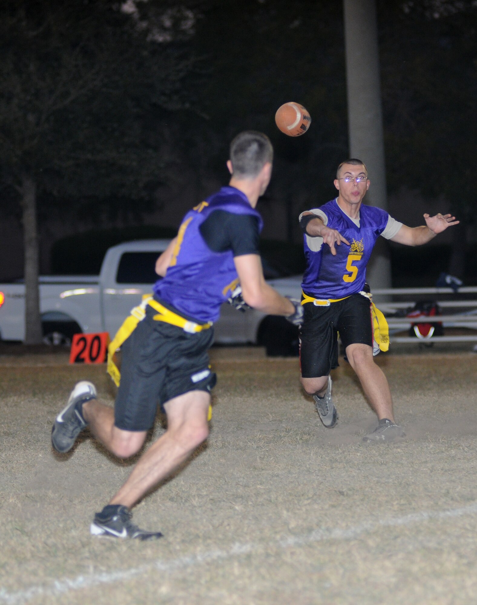 Isaiah Maylott, 338th Training Squadron, turns to catch a pass made by quarterback, Collin Benton, during an intramural flag football game against the 335th Training Squadron Nov. 1, 2012, at Keesler Air Force Base, Miss.  The Bulls defeated the Dark Knights, 26-20.  (U.S. Air Force photo by Kemberly Groue)
