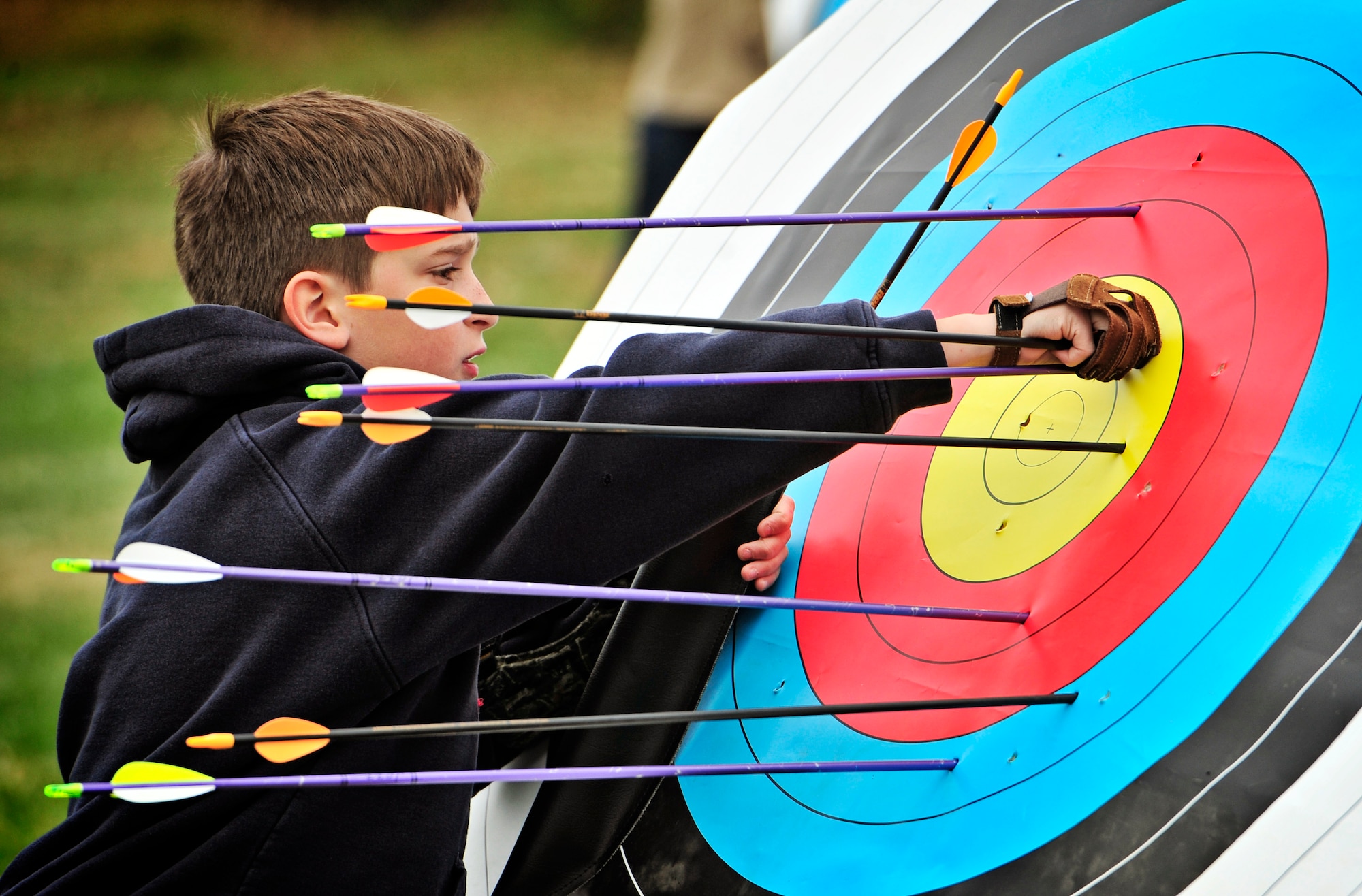 A competitor retrieves his arrows after a warmup session prior to an archery tournament at Scott Air Force base Nov. 5. The Scott Outdoor Recreation hosted the event which was opened to all ages and skill levels. The top finisher was Jared Lyles, 13. (U.S. Air Force photo/ Staff Sgt. Ryan Crane)