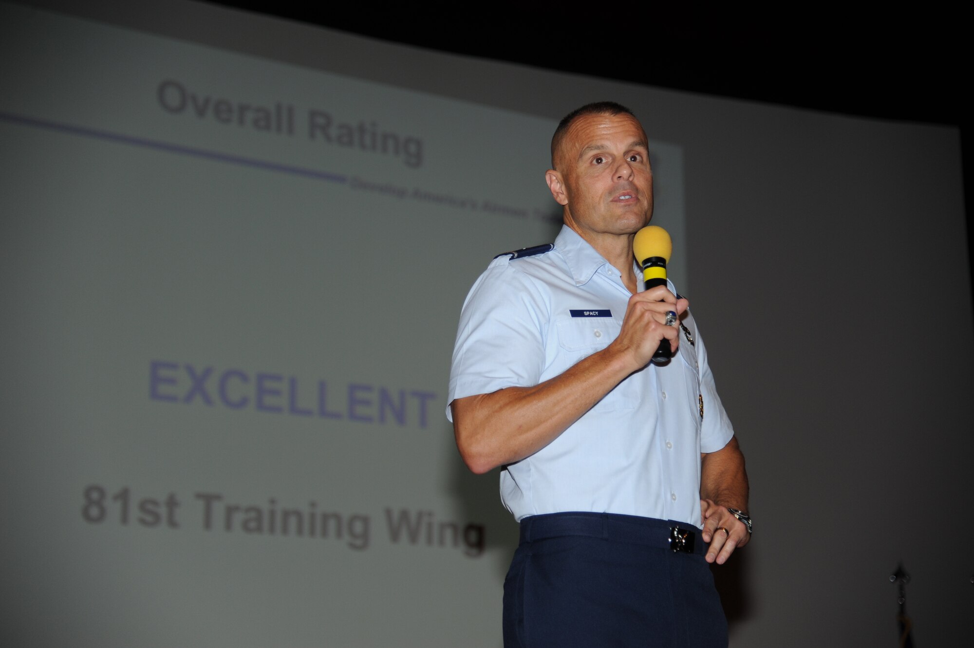 Brig. Gen. Brad Spacy, 81st Training Wing commander, provides closing remarks to members of the 81st TRW on the Excellent rating the base received during the consolidated unit inspection out brief Nov. 5, 2012, at the Welch Theater, Keesler Air Force Base, Miss.  The CUI was held from Oct. 29-Nov. 2, and evaluated the base’s level of compliance with Air Force and Department of Defense guidelines.  (U.S. Air Force photo by Kemberly Groue)