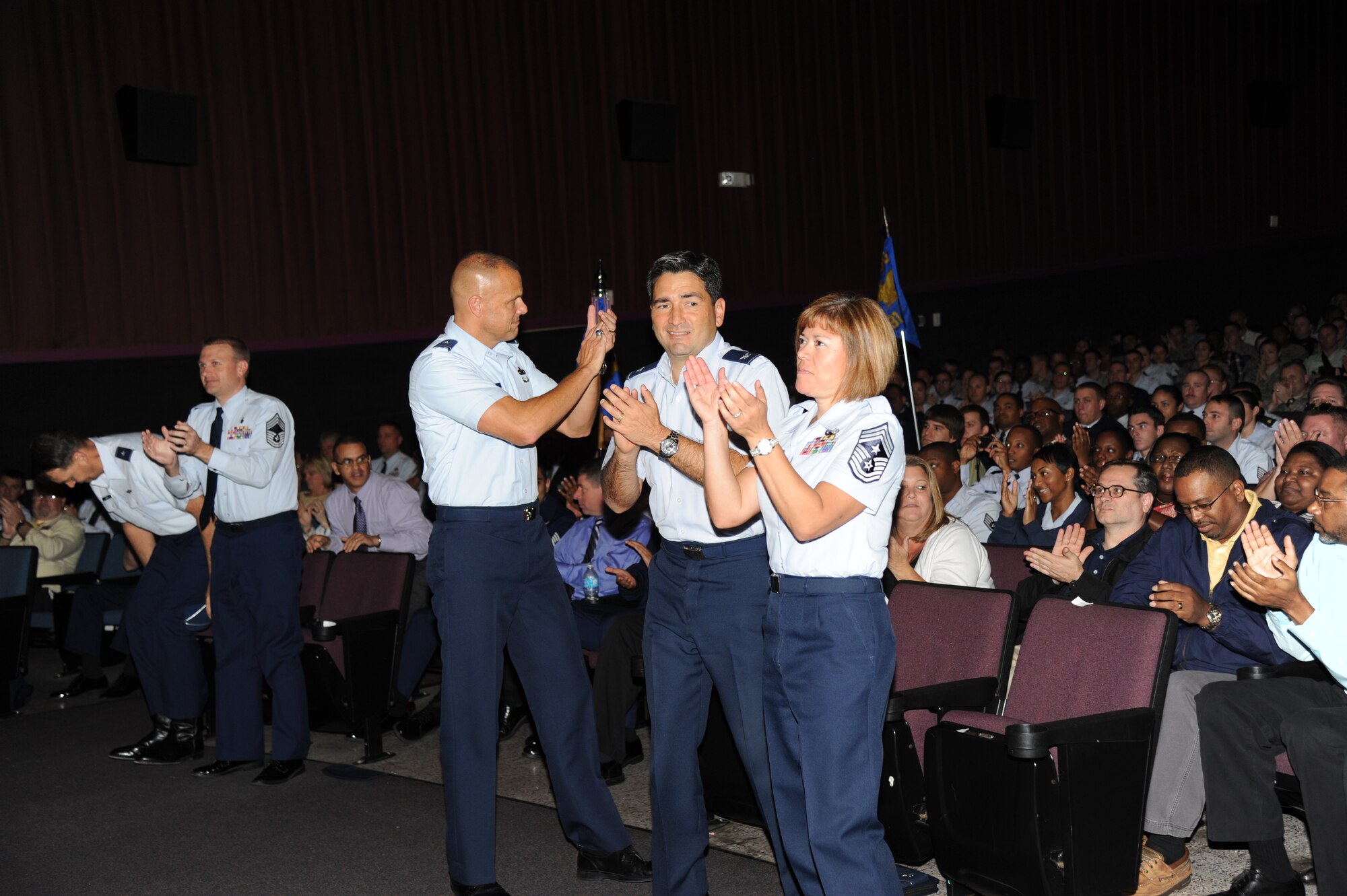 Brig. Gen. Brad Spacy, 81st Training Wing commander; Col. Rene Romero, 81st TRW vice commander, and Chief Master Sgt. Angelica Johnson, 81st TRW command chief, are pleased with the Excellent rating the base received during the consolidated unit inspection out brief Nov. 5, 2012, at the Welch Theater, Keesler Air Force Base, Miss.  The CUI was held from Oct. 29-Nov. 2, and evaluated the base’s level of compliance with Air Force and Department of Defense guidelines.  (U.S. Air Force photo by Kemberly Groue)
