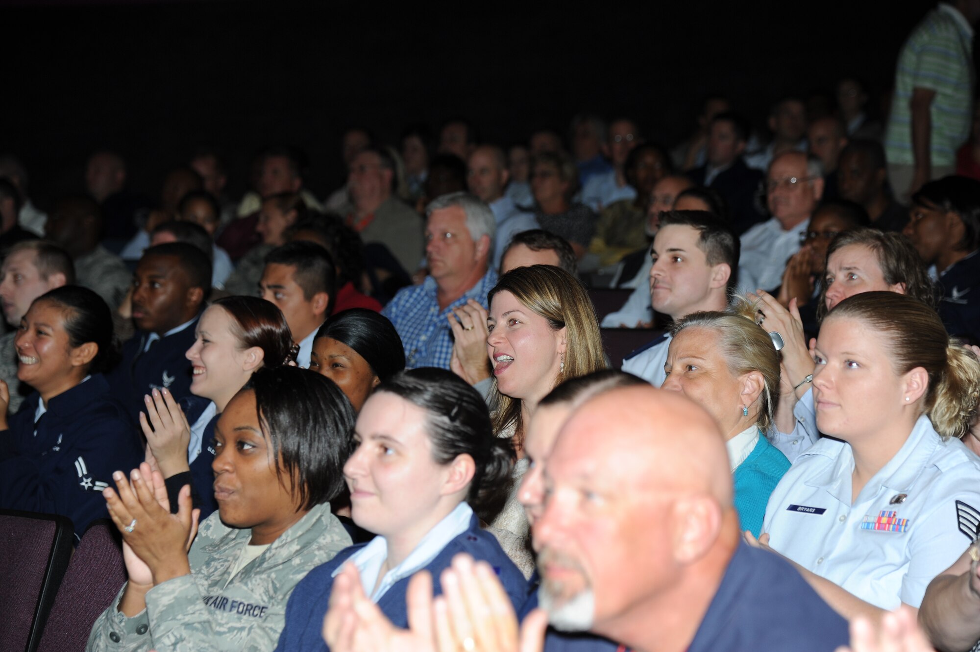 Members of the 81st Training Wing cheer after finding out the wing received an Excellent rating during the consolidated unit inspection out brief Nov. 5, 2012, at the Welch Theater, Keesler Air Force Base, Miss.  The CUI was held from Oct. 29-Nov. 2, and evaluated the base’s level of compliance with Air Force and Department of Defense guidelines.  (U.S. Air Force photo by Kemberly Groue)